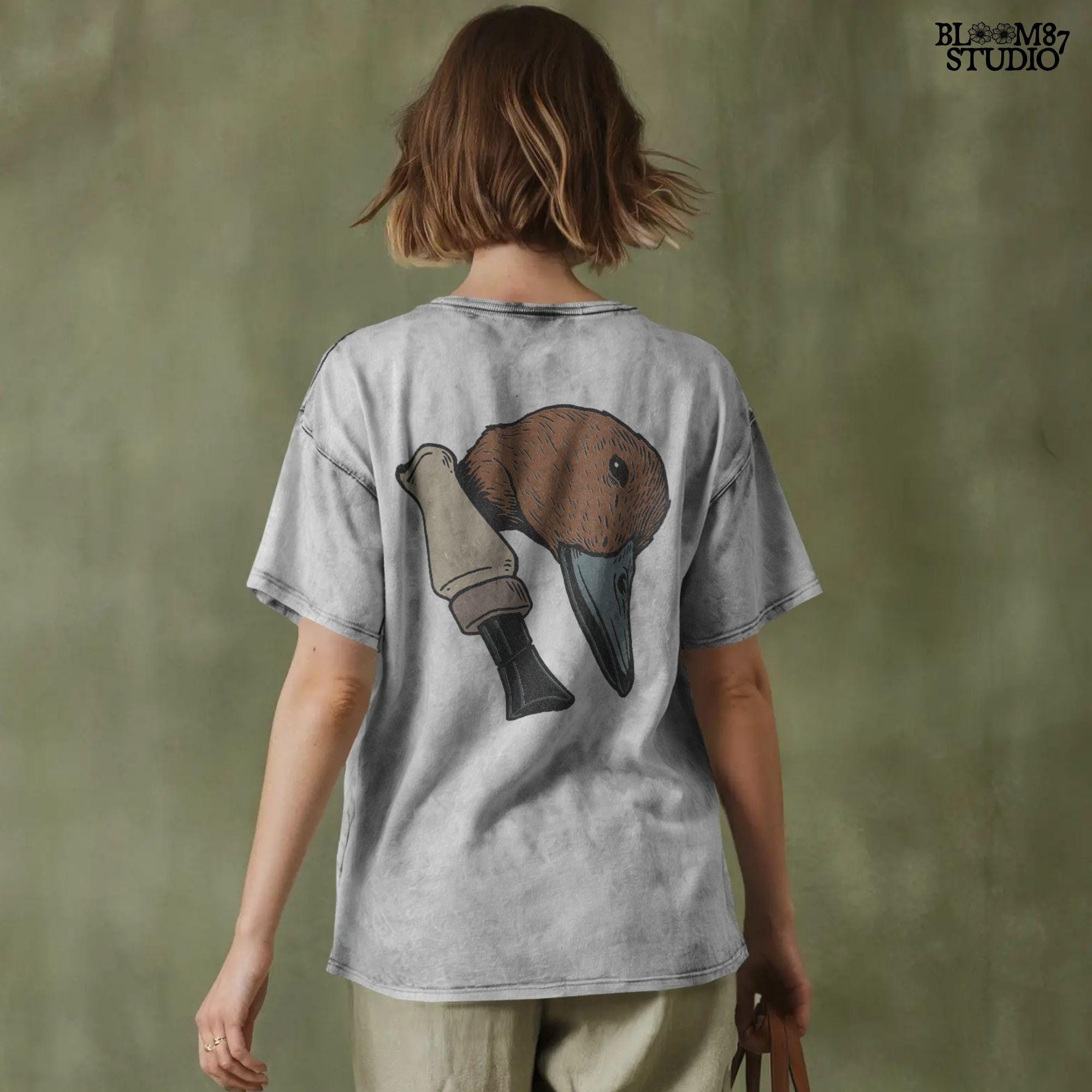 Solid version: "Duck hunting sublimation PNG with rustic mallard head and duck call clipart for outdoorsman shirt design solid style"

Distressed version: "Distressed duck hunting sublimation PNG mallard head with duck call rustic waterfowl clipart for lodge and cabin crafts"