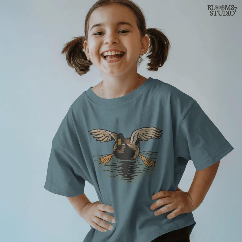 Solid Version:
Vintage-style sublimation of a duck landing on water with wings spread wide, great for rustic shirts or wildlife-themed crafts.

Distressed Version:
Distressed flying duck illustration landing on a pond, rustic clipart style ideal for outdoor nature designs and hunting-themed sublimation.