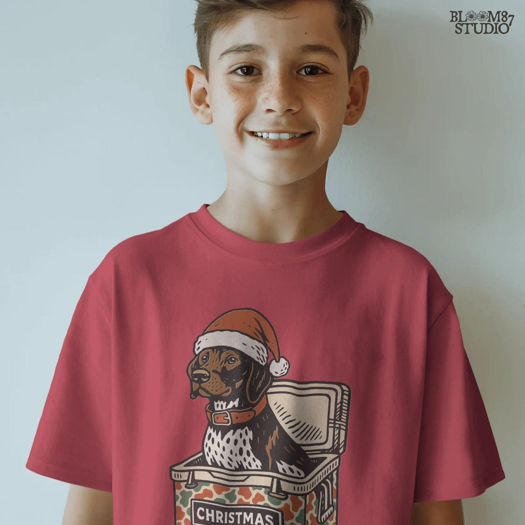 Solid Version:
Vintage illustration of a dog in a Santa hat sitting inside a camo-patterned Christmas cooler, sublimation PNG for rustic holiday crafts and pet decor.

Distressed Version:
Distressed artwork of a Christmas dog in camo cooler with Santa hat, funny sublimation PNG perfect for farmhouse festive shirts, mugs, and seasonal gifts.