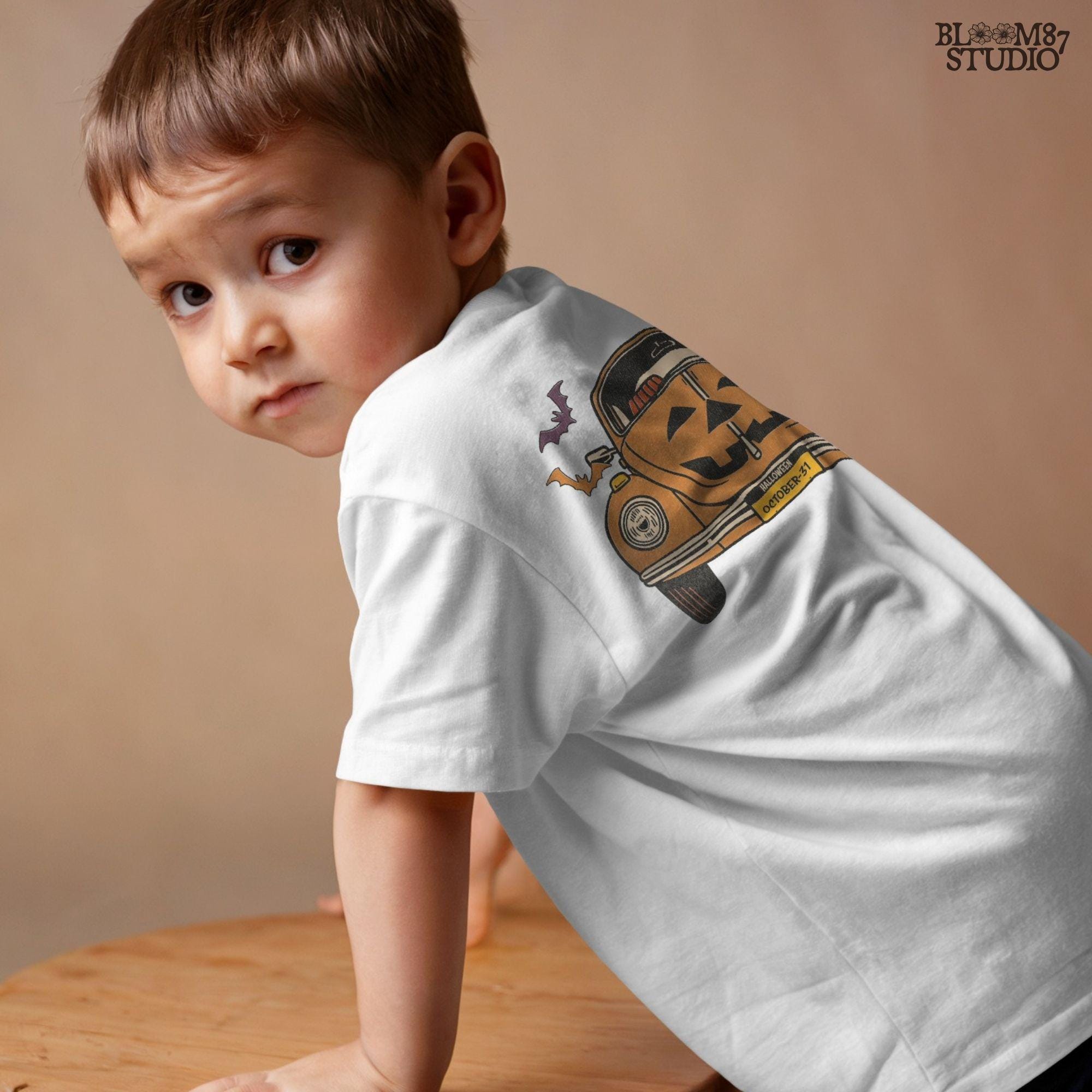 Halloween pumpkin car with Jack O’Lantern face, flying bats, and October 31 theme, retro spooky sublimation PNG design.