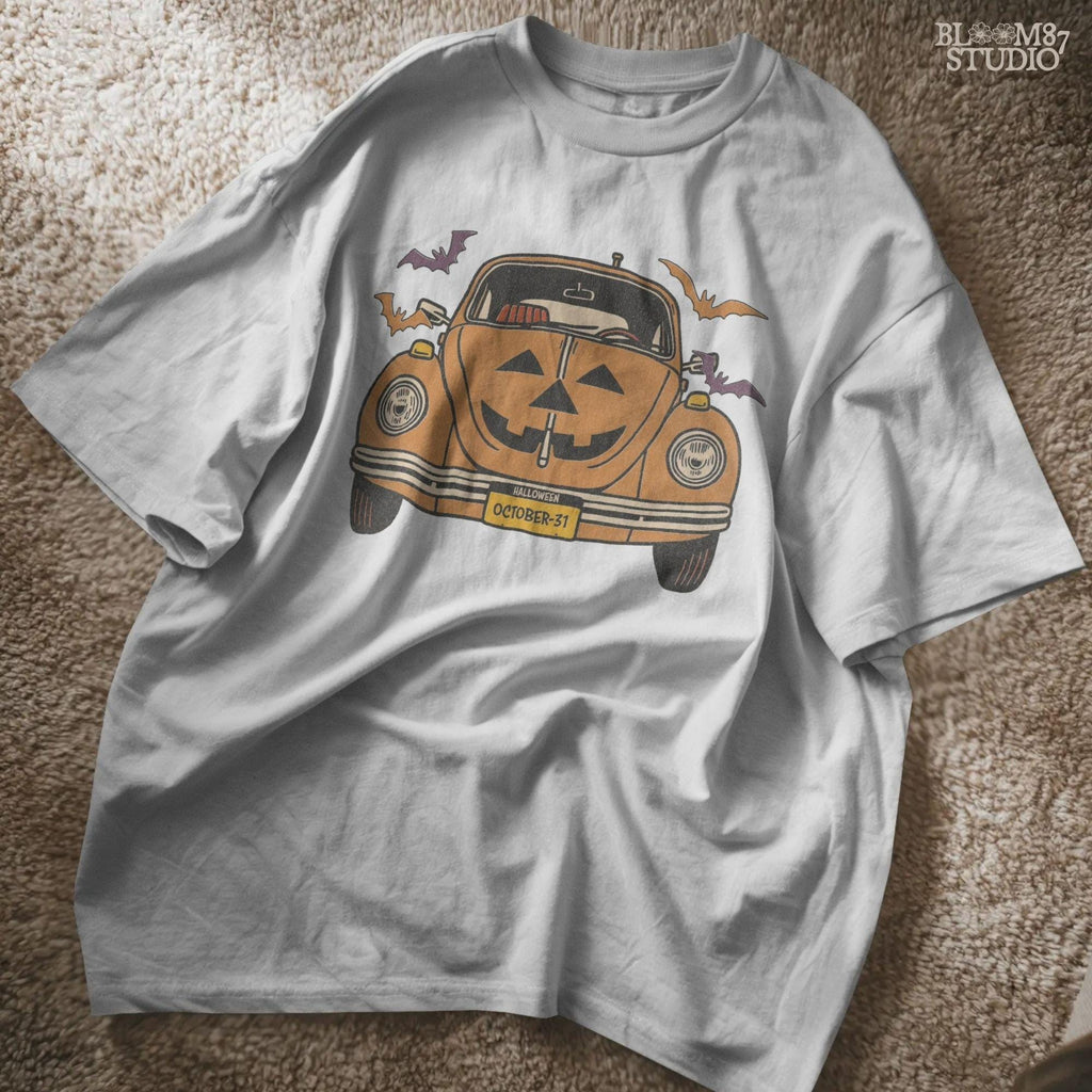 Halloween pumpkin car with Jack O’Lantern face, flying bats, and October 31 theme, retro spooky sublimation PNG design.
