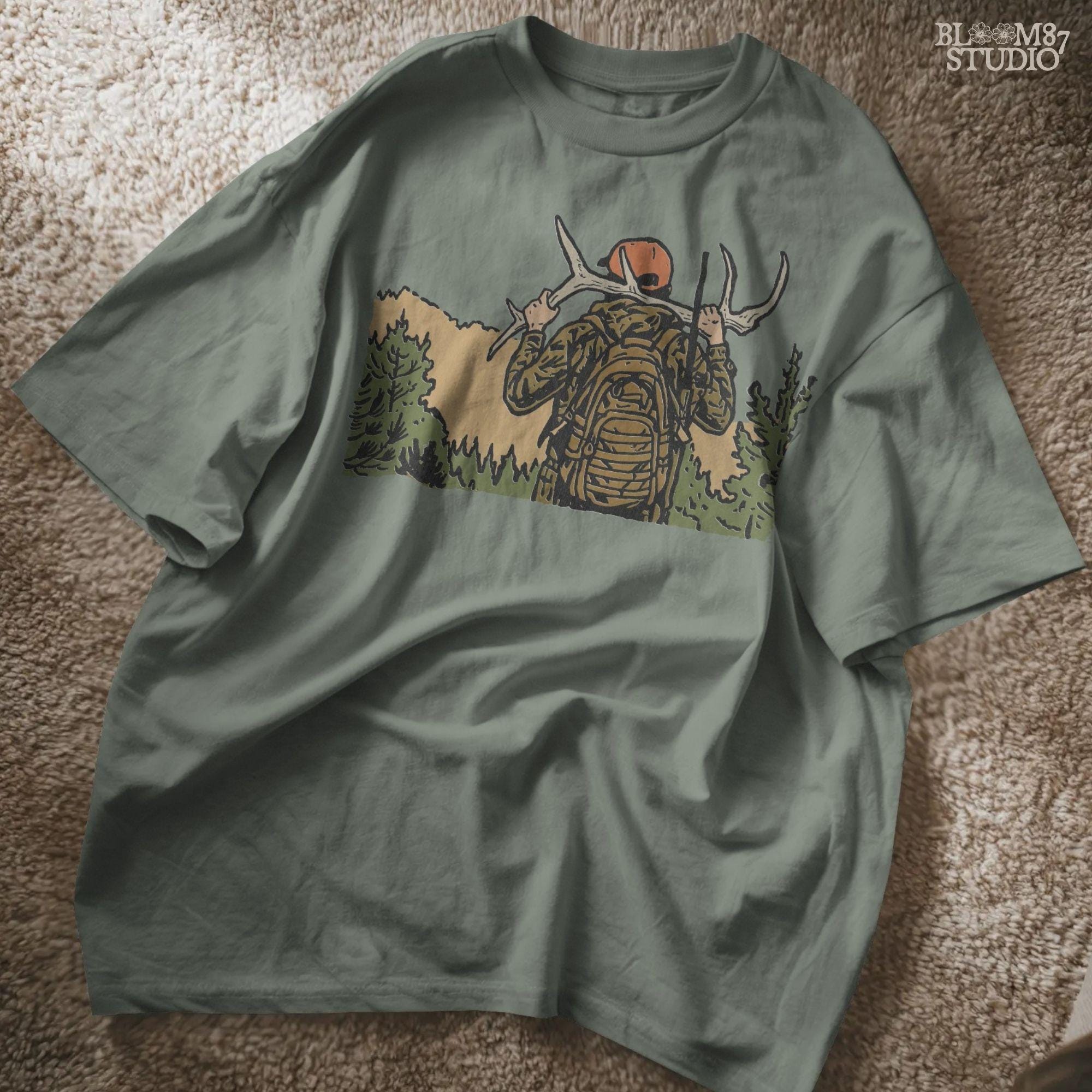 Solid version:
“Hunter carrying deer antlers on shoulders with backpack and rifle in forest – rustic hunting sublimation PNG for outdoor crafts”

Distressed version:
“Vintage distressed hunting sublimation PNG of hunter in camo with backpack and rifle carrying antlers in forest”