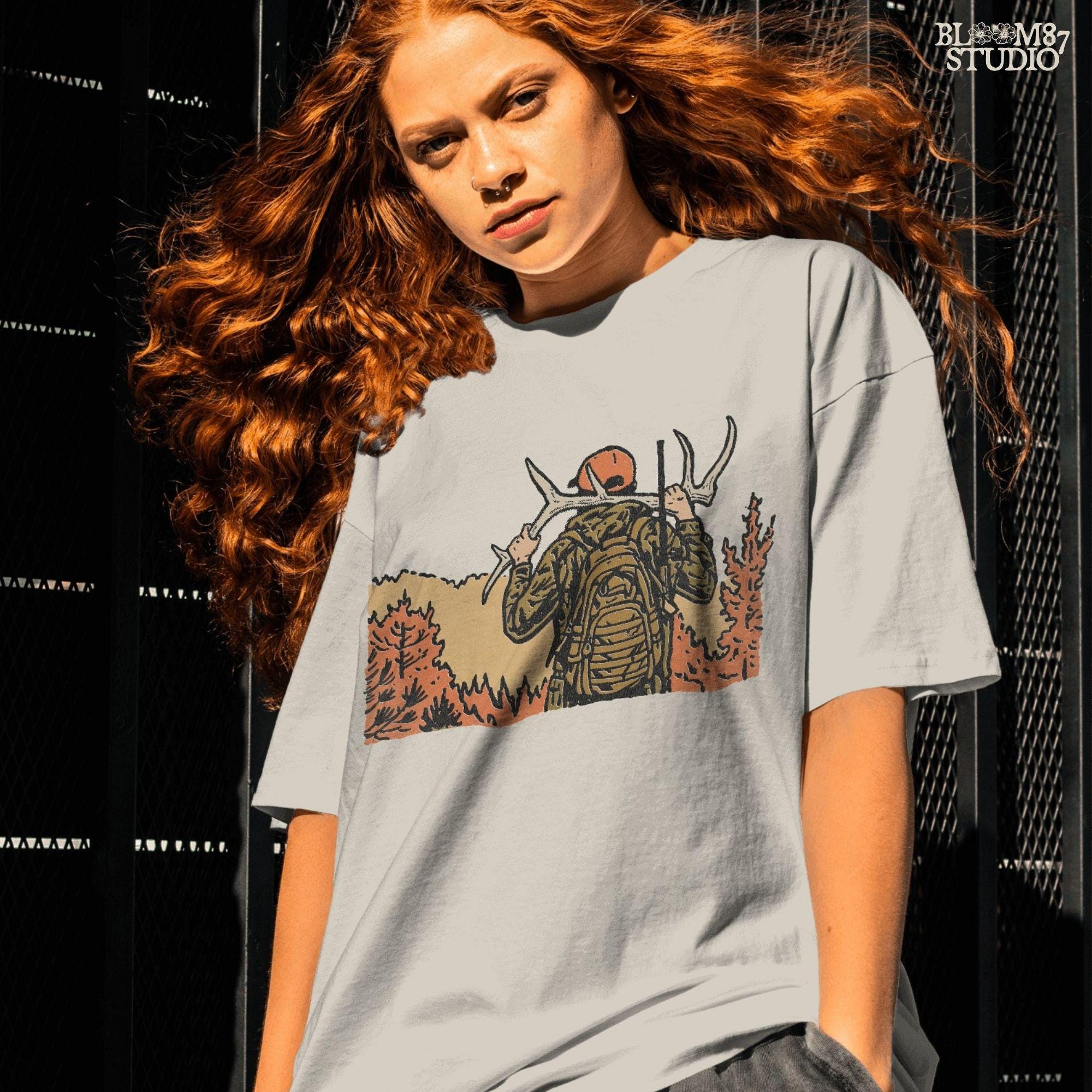 Solid version:
“Hunter carrying deer antlers with backpack in autumn forest – rustic hunting sublimation PNG for shirts and outdoor crafts”

Distressed version:
“Vintage distressed hunting sublimation PNG of hunter with antlers and backpack in autumn forest – rustic outdoor shirt design”