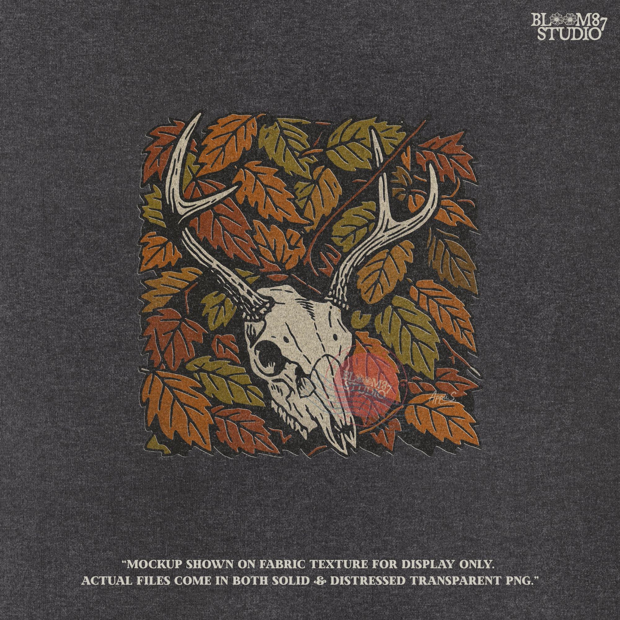 Deer skull with antlers surrounded by autumn leaves, rustic fall hunting sublimation PNG design.