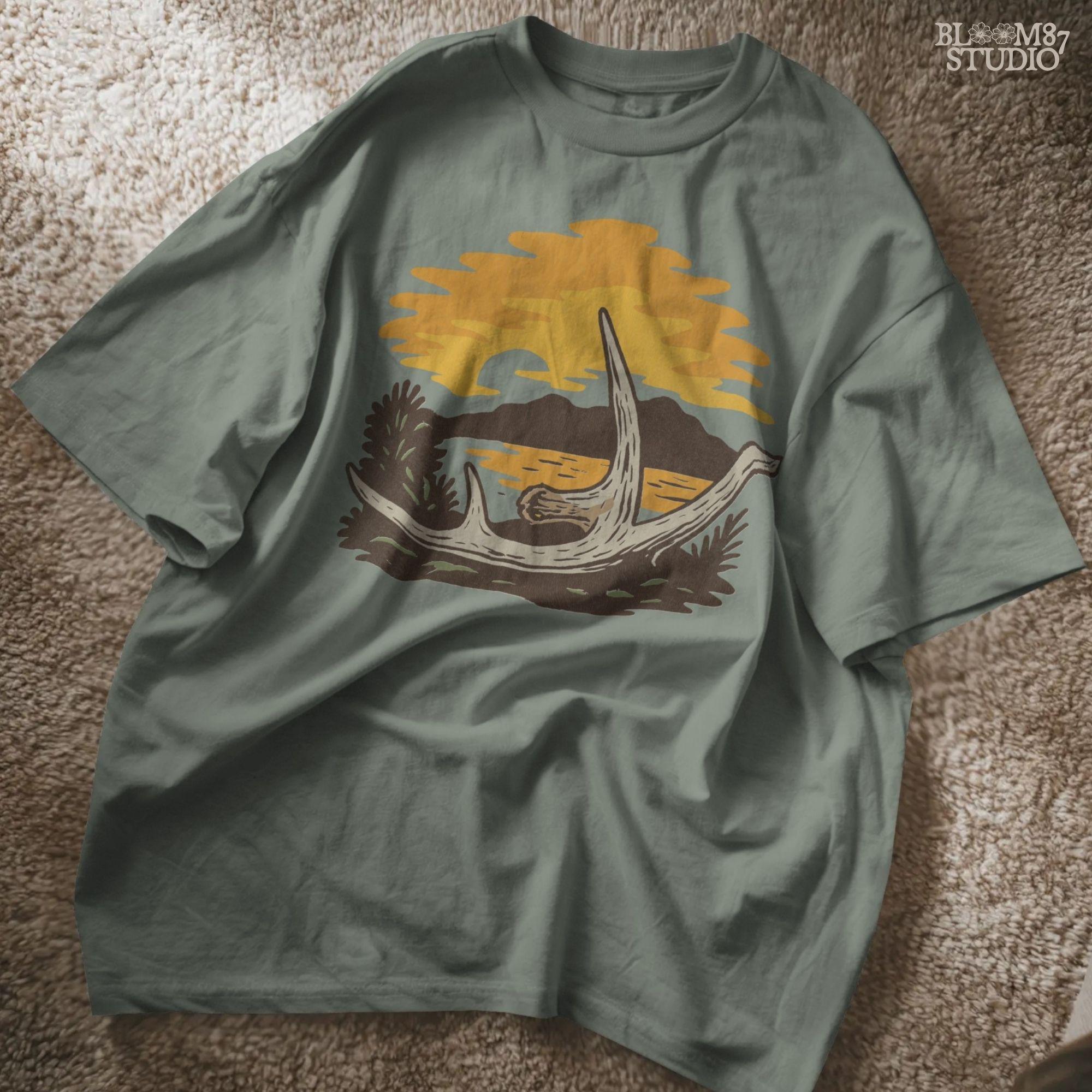 Solid version:
“Deer shed antlers on ground with fall sunset, mountains, and lake – rustic autumn antler sublimation PNG for shirts and crafts”

Distressed version:
“Vintage distressed sublimation PNG of deer shed antlers at autumn sunset by mountains and lake – rustic hunting season design”