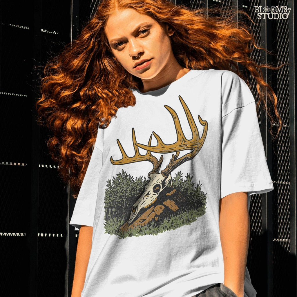Solid version:
“Deer skull with large antlers resting in grass and rocks – rustic hunting sublimation PNG for crafts and lodge décor”

Distressed version:
“Vintage distressed sublimation PNG of deer skull with antlers in grass – rustic hunting and outdoor lodge shirt design”