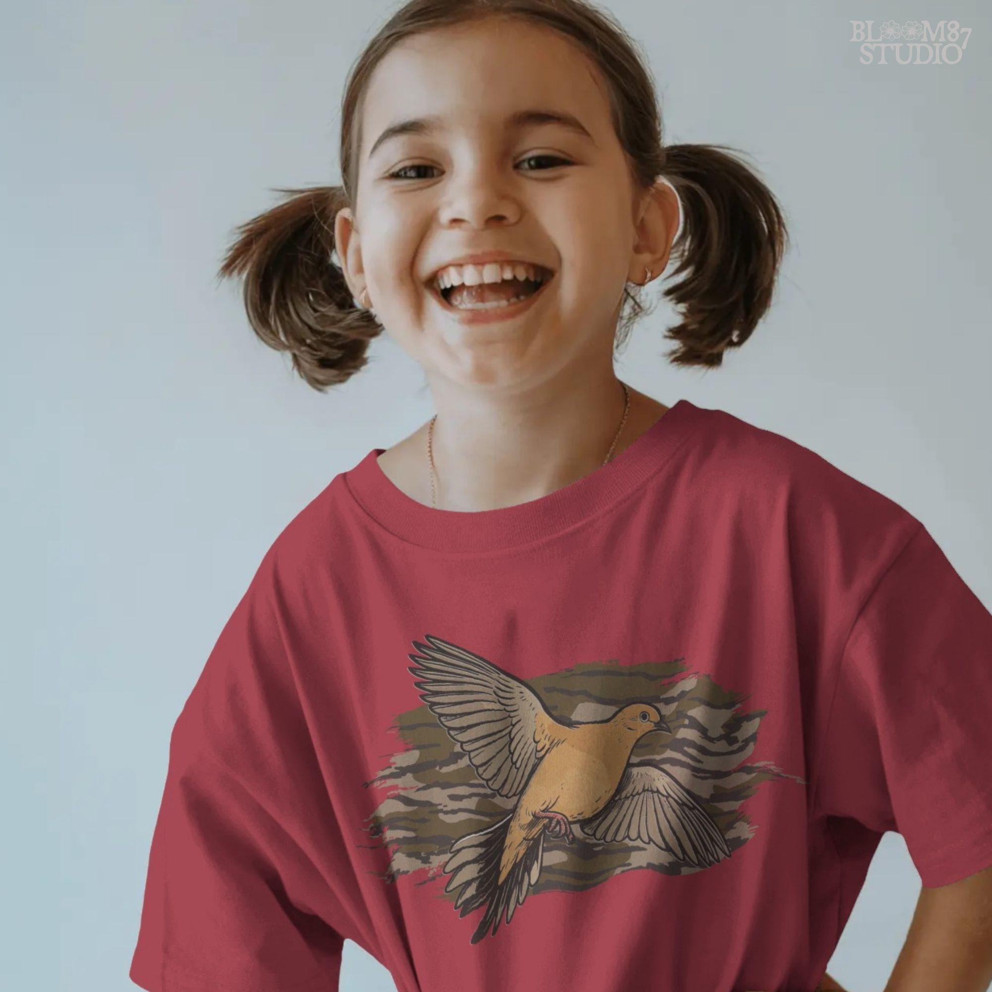 Solid version: Illustration of a mourning dove flying with wings spread, set against a camouflage background, hunting sublimation PNG.
Distressed version: Vintage mourning dove in flight with camo background, rustic distressed hunting PNG for outdoor crafts.