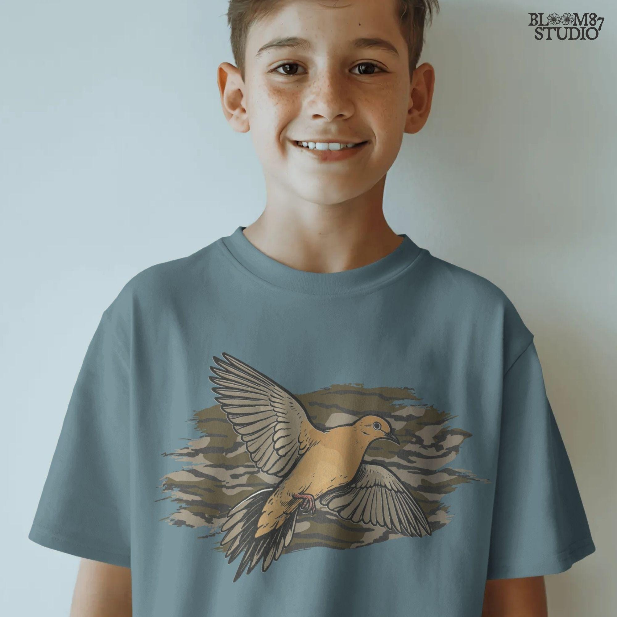 Solid version: Illustration of a mourning dove flying with wings spread, set against a camouflage background, hunting sublimation PNG.
Distressed version: Vintage mourning dove in flight with camo background, rustic distressed hunting PNG for outdoor crafts.