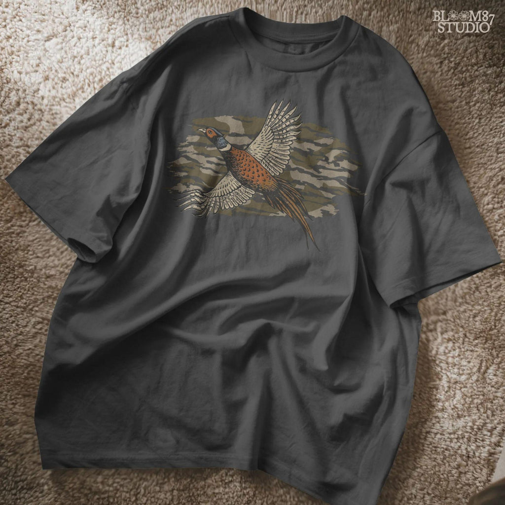 Solid version: Illustration of a flying pheasant with camouflage background, hunting sublimation PNG.
Distressed version: Vintage distressed pheasant in flight with camo backdrop, rustic hunting sublimation PNG.