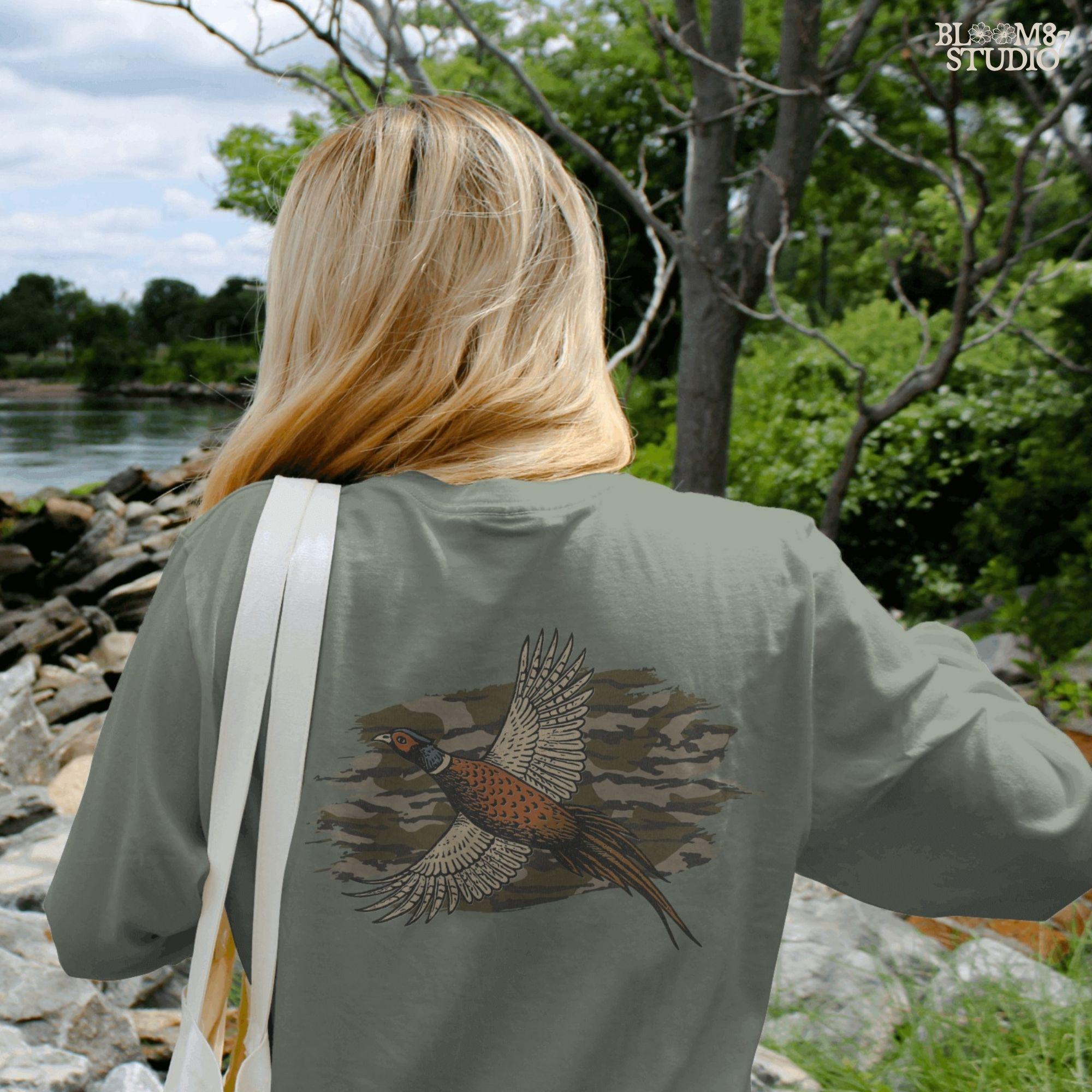 Solid version: Illustration of a flying pheasant with camouflage background, hunting sublimation PNG.
Distressed version: Vintage distressed pheasant in flight with camo backdrop, rustic hunting sublimation PNG.