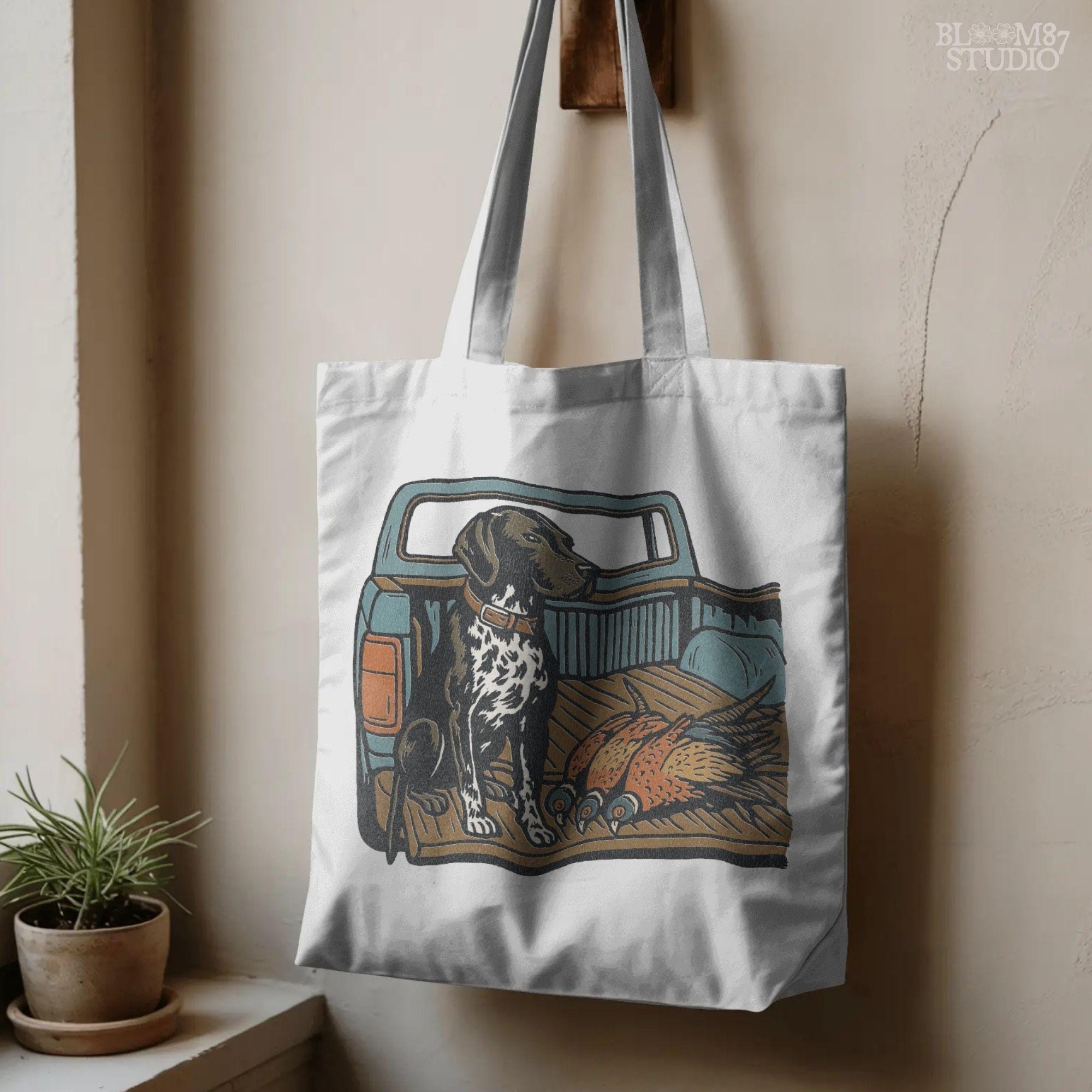 Illustration of a German Shorthaired Pointer hunting dog sitting in a pickup truck with three pheasants, sublimation PNG design.