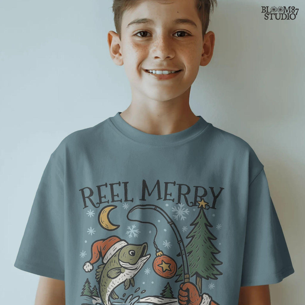 Solid: “Christmas fishing PNG with bass wearing Santa hat jumping near holiday tree, Reel Merry text design for shirts”

Distressed: “Vintage distressed Christmas fishing PNG with bass, Santa hat, holiday tree and Reel Merry festive design”