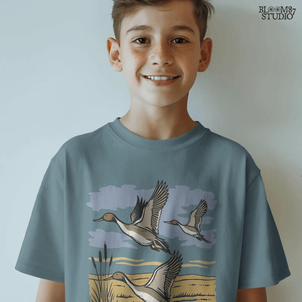Rustic illustration of pintail ducks flying over wetlands, detailed waterfowl PNG for sublimation, hunting crafts, and wildlife decor.