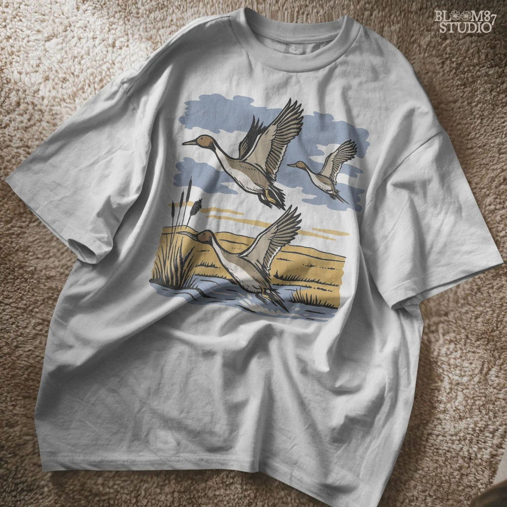 Rustic illustration of pintail ducks flying over wetlands, detailed waterfowl PNG for sublimation, hunting crafts, and wildlife decor.