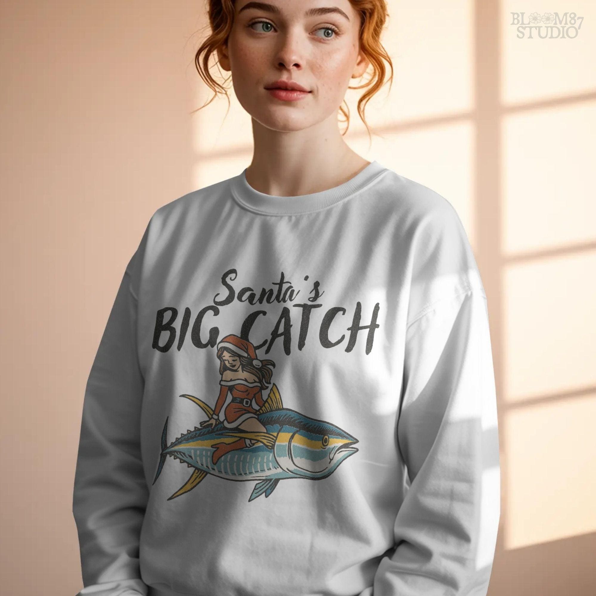 Christmas fishing sublimation design Santa’s Big Catch. Retro Santa girl in holiday outfit sits on a tuna fish, perfect for fisherman gifts, Christmas shirts, mugs, and seasonal DIY projects. Transparent PNG clipart for sublimation or transfers. A humorous fishing holiday artwork for anglers and ocean lovers during Christmas.