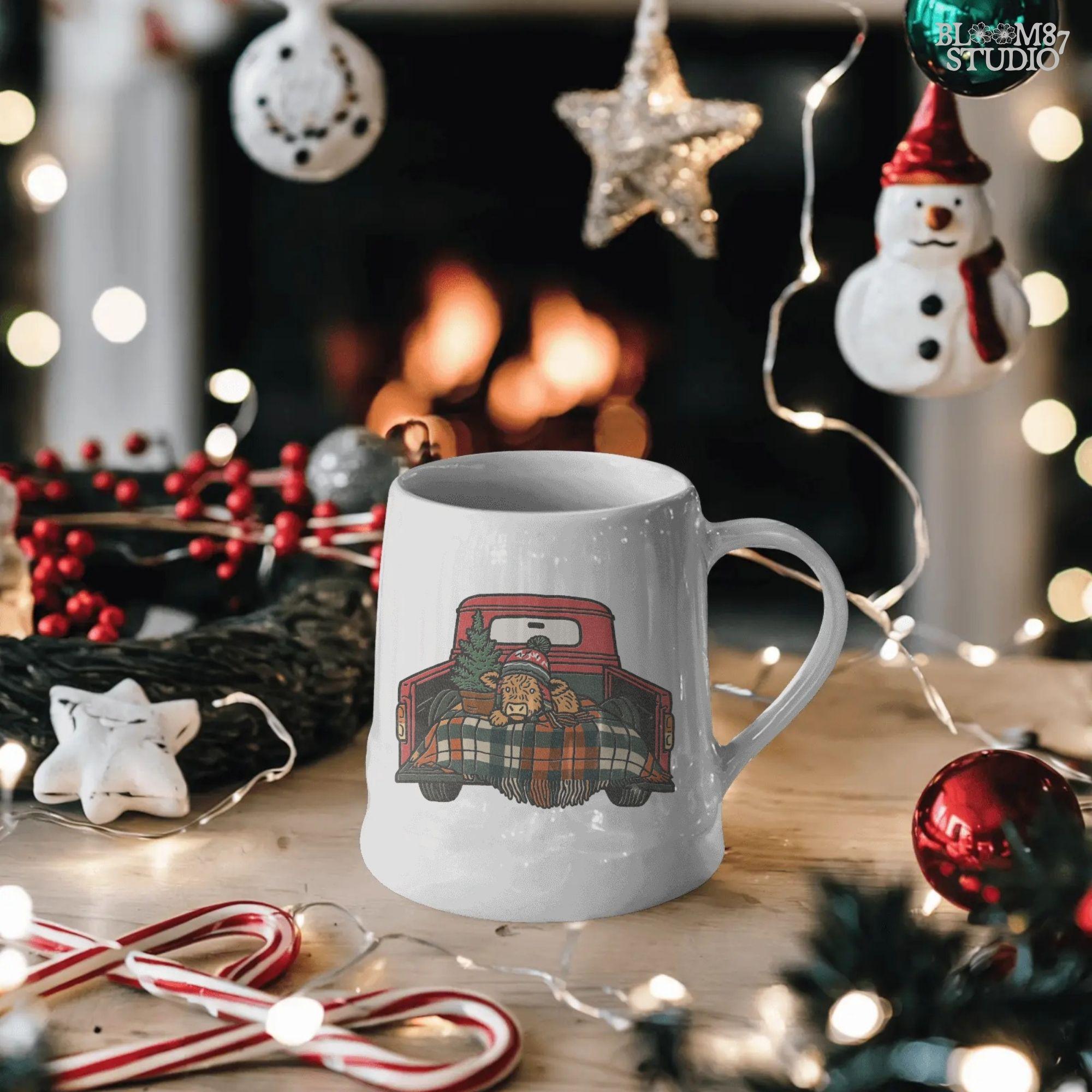 Holiday Highland cow sublimation PNG design. Features cow in red truck bed with plaid blanket and small Christmas tree. Rustic Christmas artwork perfect for shirts, mugs, tumblers, farmhouse holiday gifts, or cozy seasonal decor projects. Transparent PNG for easy use.