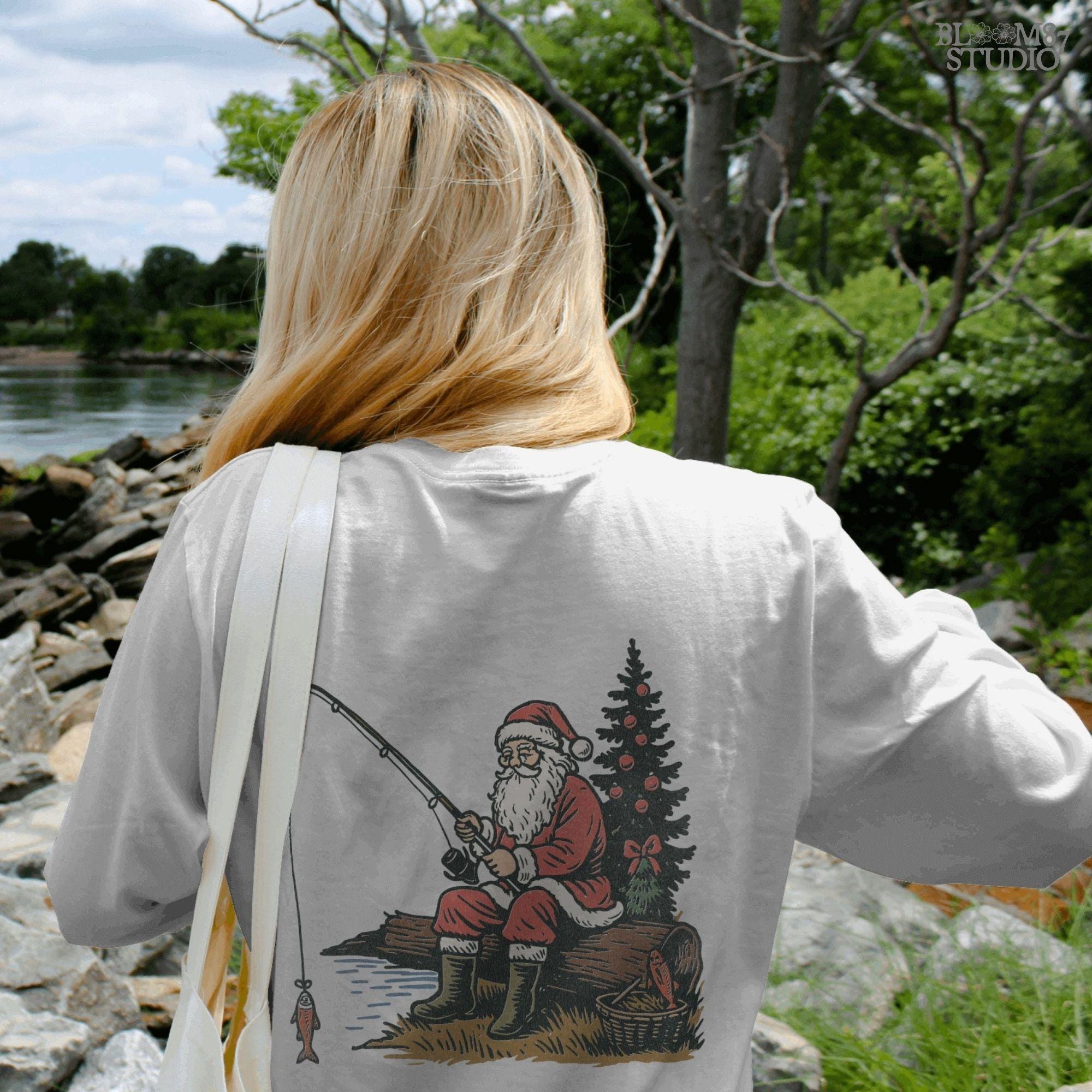 Solid Version: "Santa Claus in red suit sitting on a log fishing near Christmas tree with ornaments, festive PNG sublimation design for crafts and gifts"
Distressed Version: "Vintage distressed PNG of Santa fishing by a decorated Christmas tree, rustic sublimation design for holiday shirts, mugs, and ornaments"