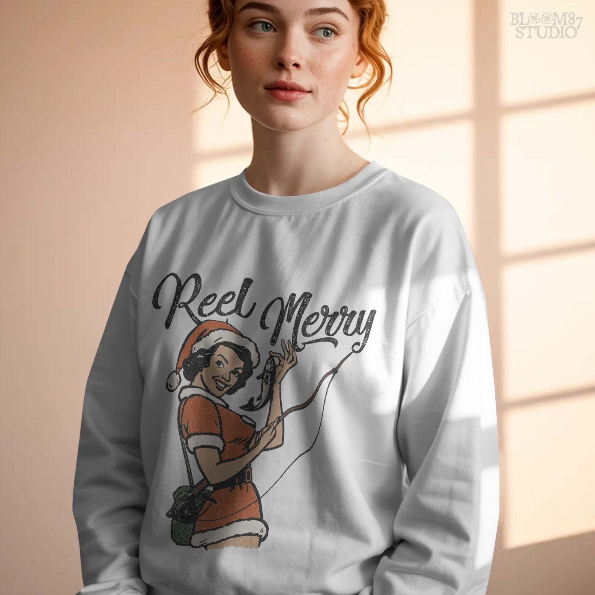 Festive "Reel Merry" design featuring a retro woman in Santa dress with a fish in hand, ideal for sublimation or print.