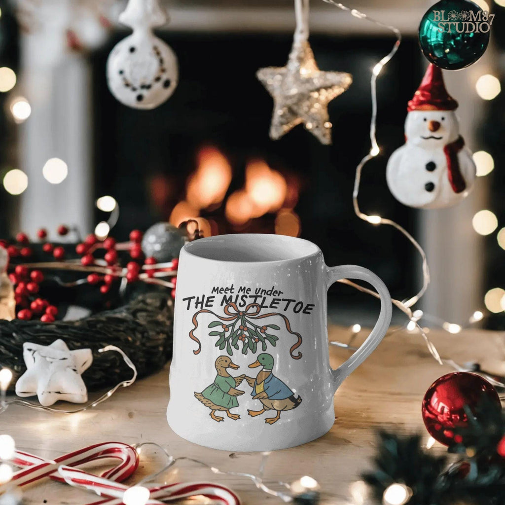 Hand-drawn duck couple PNG in Christmas-themed clothing and mistletoe, ready for digital download and sublimation.