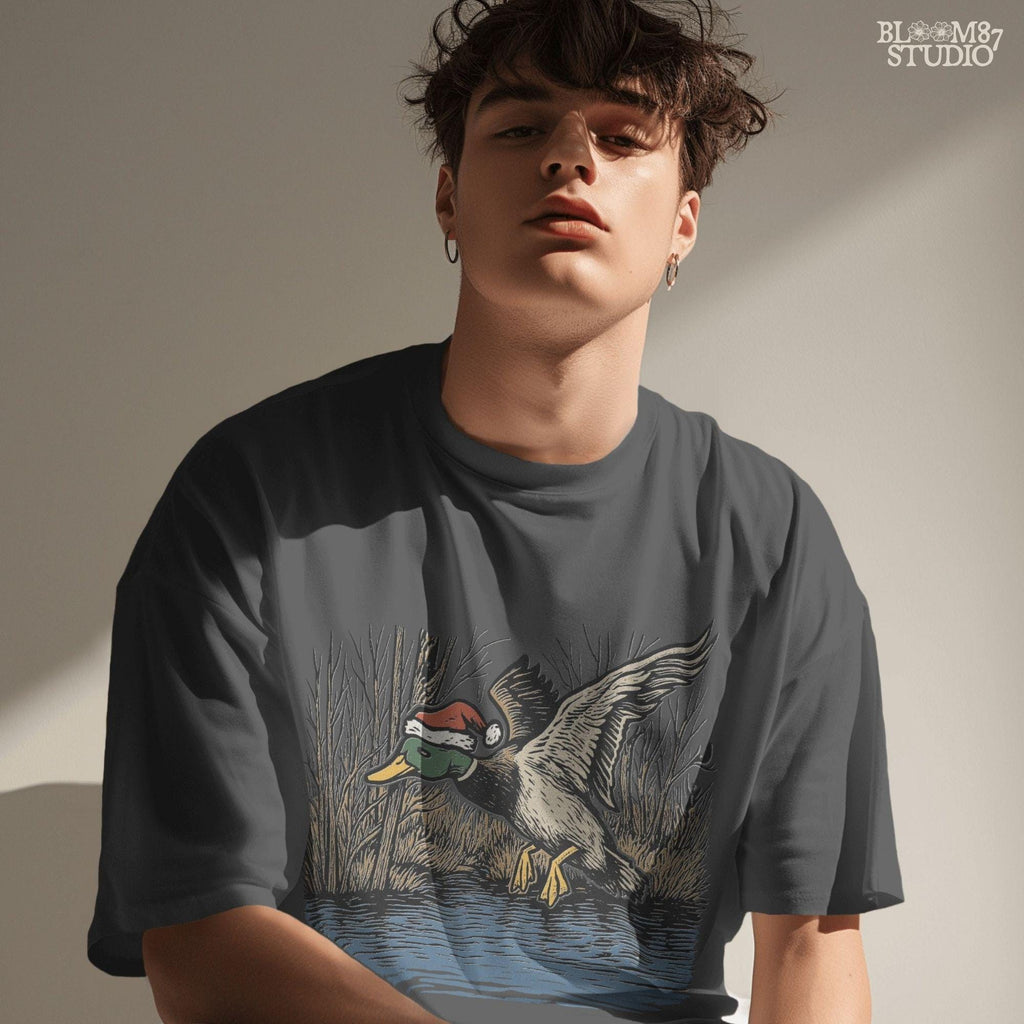 Mallard duck flying clipart for hunters and Christmas lovers. This PNG design shows a mallard in Santa hat over a winter marsh. Great for duck hunting shirt designs, Christmas waterfowl mugs, or holiday wall prints.