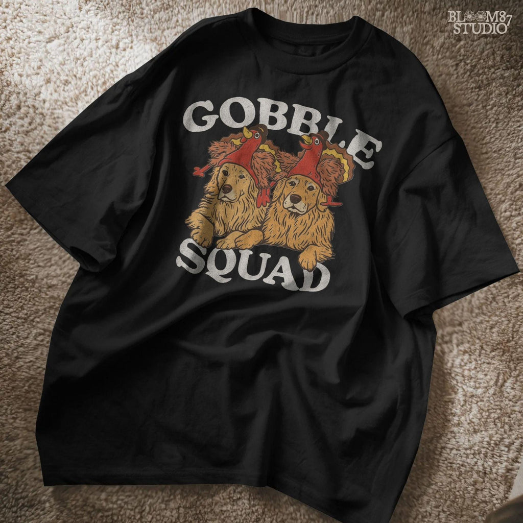 Golden retriever clipart for Thanksgiving showing two retrievers in turkey hats under the words Gobble Squad. Perfect for autumn holiday crafts, sublimation shirts, mugs, and fall decor projects.