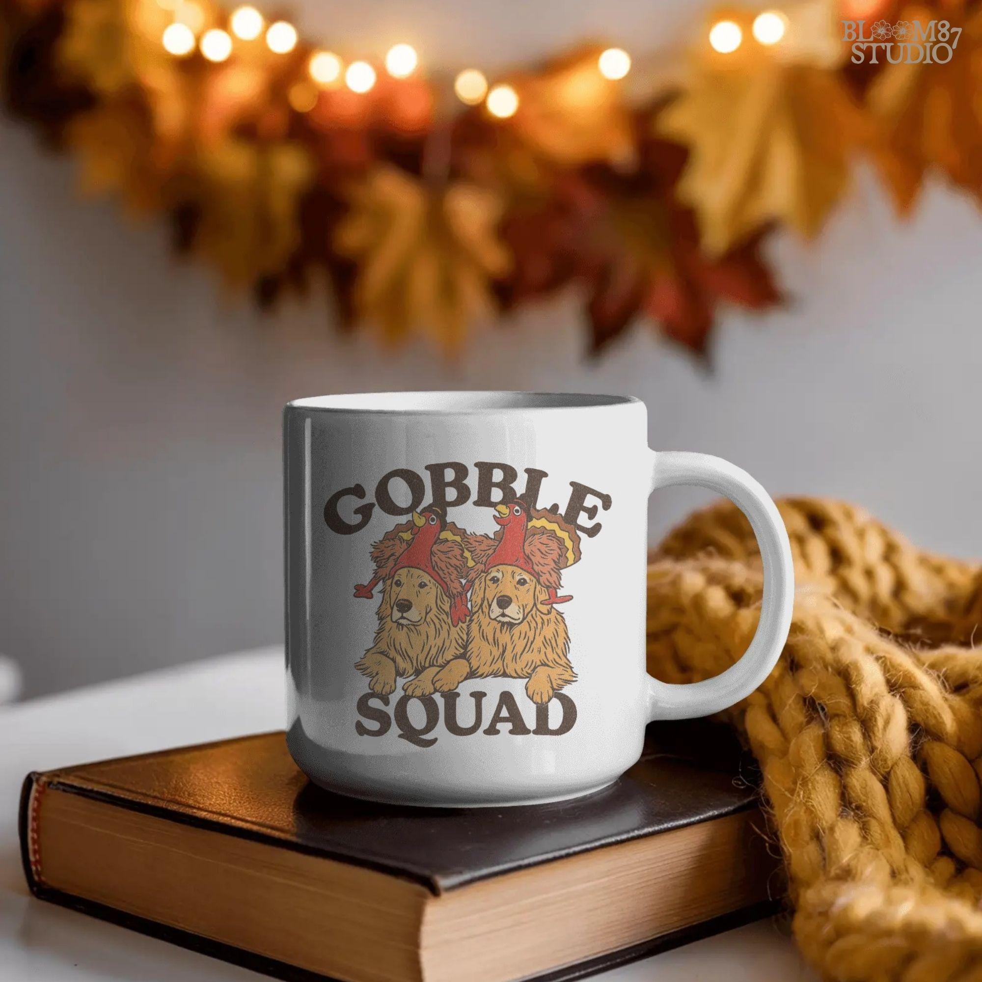 A humorous Thanksgiving dog design featuring golden retrievers in turkey hats. Perfect for Gobble Squad holiday shirts, mugs, funny farmhouse wall art, and fall gifts.