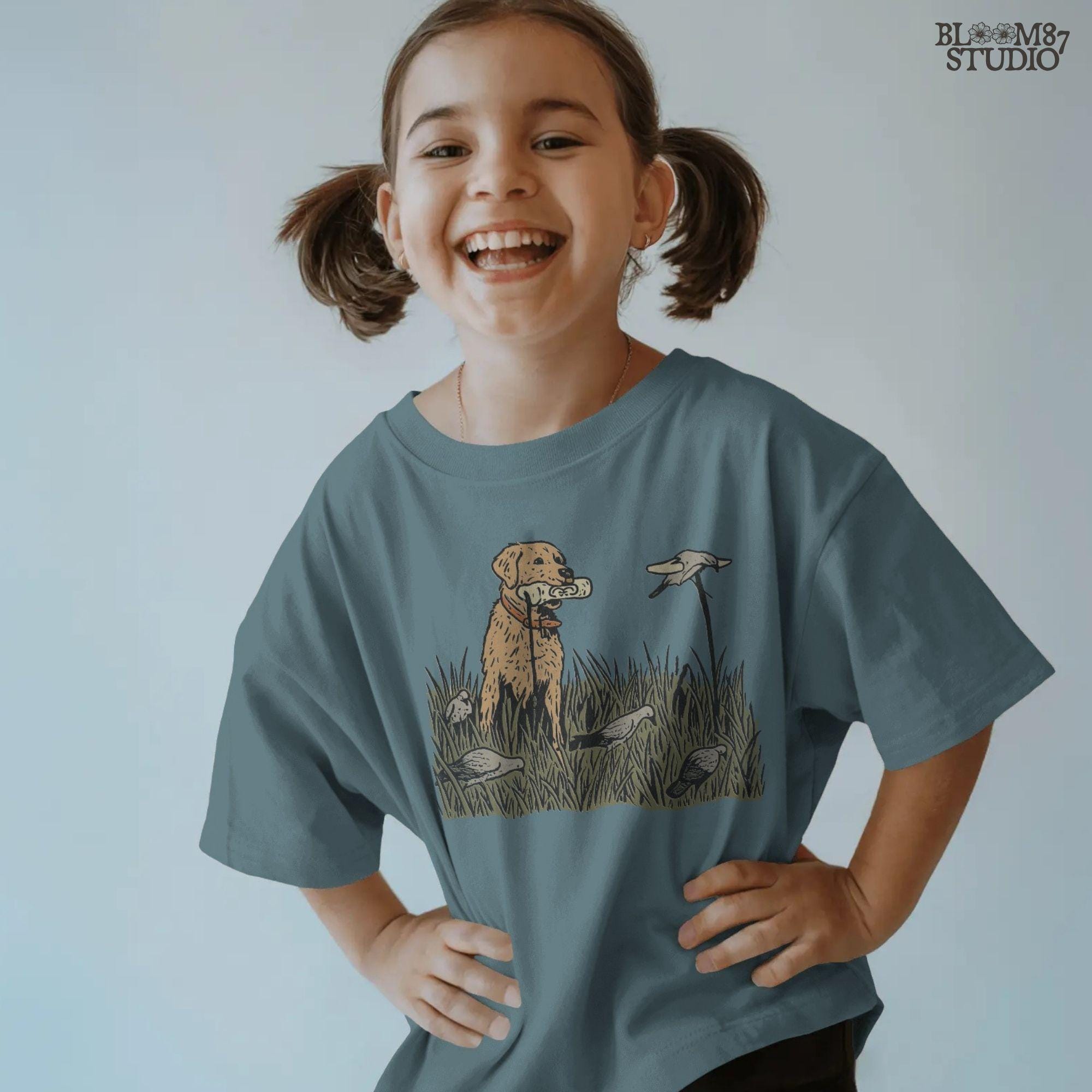 Solid version: "Golden Retriever hunting dog sublimation PNG standing in tall grass with dove decoys rustic outdoor field solid design"

Distressed version: "Distressed Golden Retriever hunting dog sublimation PNG with dove decoys in tall grass rustic outdoor hunting clipart"