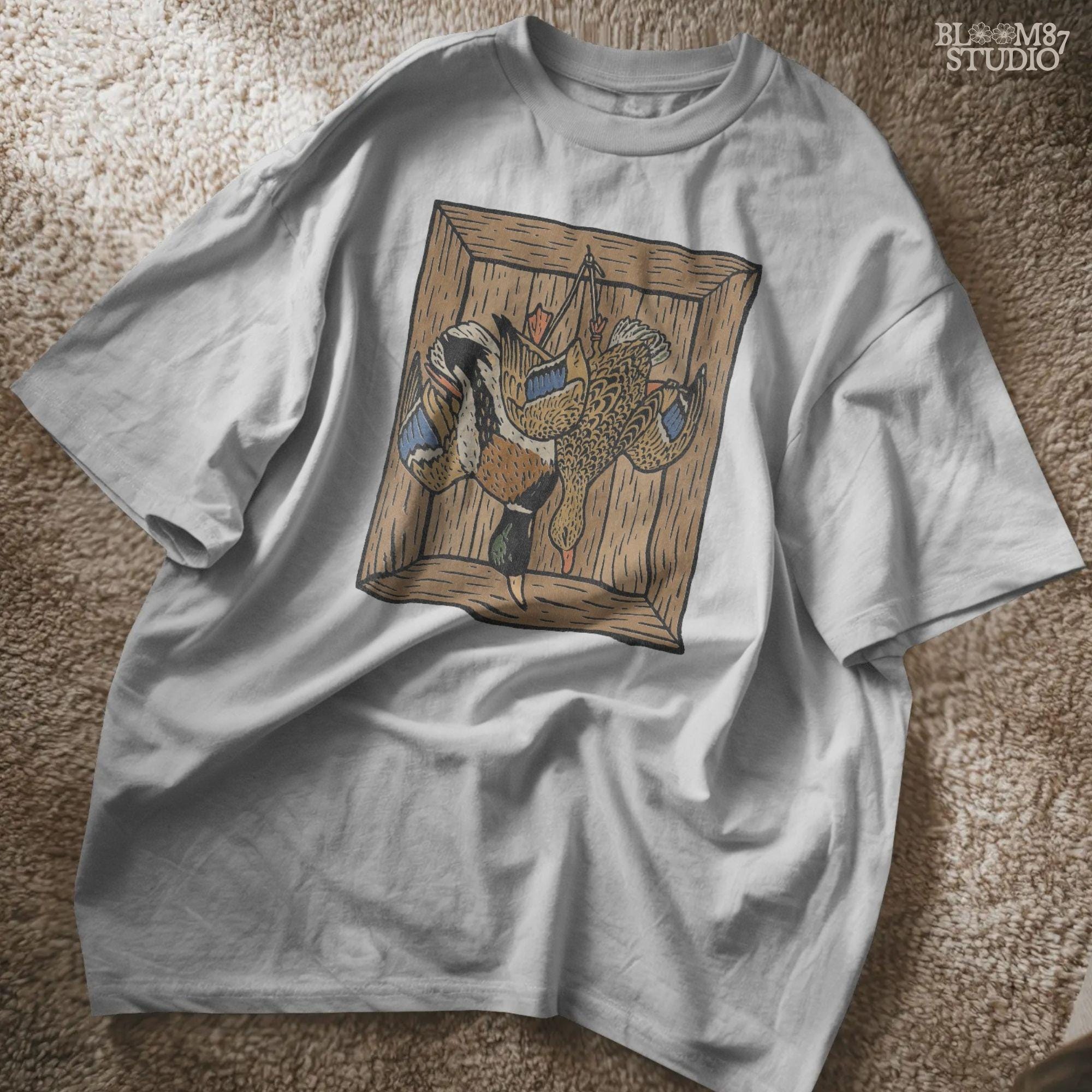Vintage-style sublimation of two ducks hanging upside down in a wooden crate, perfect for hunting decor or rustic kitchen art.

Distressed Version:
Distressed illustration of hanging ducks inside a rustic wooden box, ideal for country cabin sublimation or dark farmhouse prints.