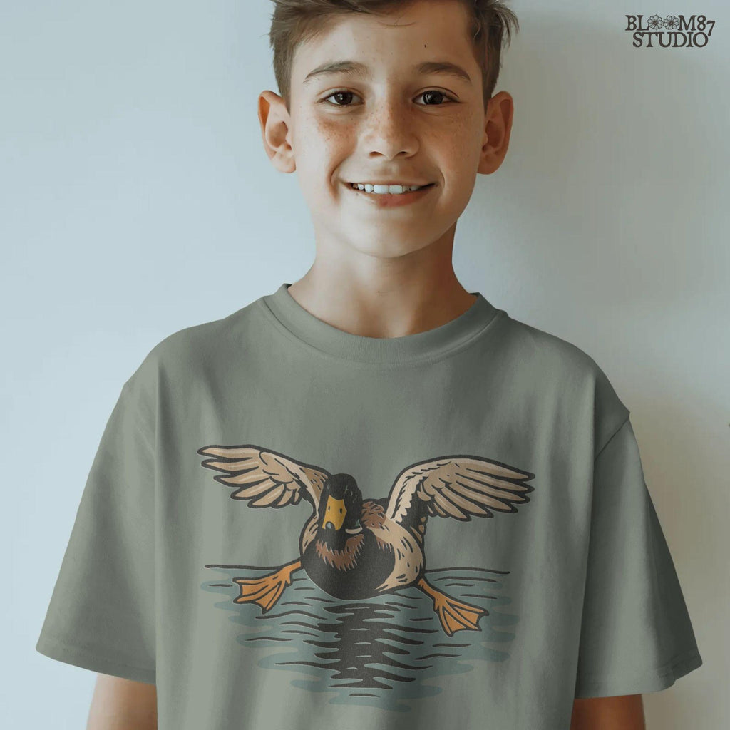 Solid Version:
Vintage-style sublimation of a duck landing on water with wings spread wide, great for rustic shirts or wildlife-themed crafts.

Distressed Version:
Distressed flying duck illustration landing on a pond, rustic clipart style ideal for outdoor nature designs and hunting-themed sublimation.