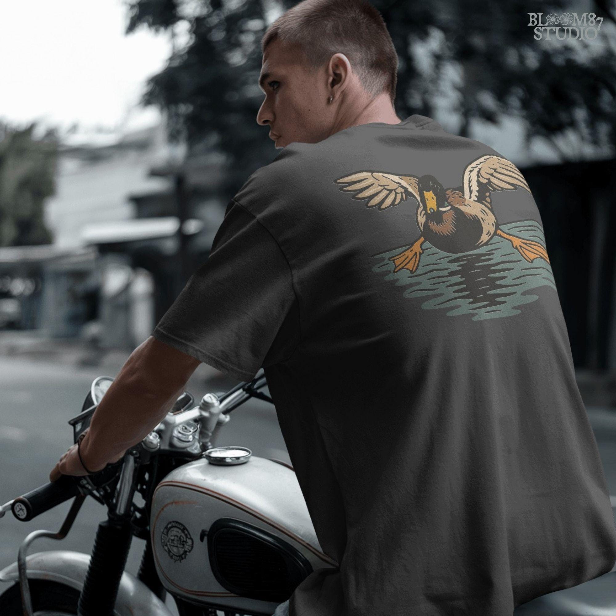 Solid Version:
Vintage-style sublimation of a duck landing on water with wings spread wide, great for rustic shirts or wildlife-themed crafts.

Distressed Version:
Distressed flying duck illustration landing on a pond, rustic clipart style ideal for outdoor nature designs and hunting-themed sublimation.