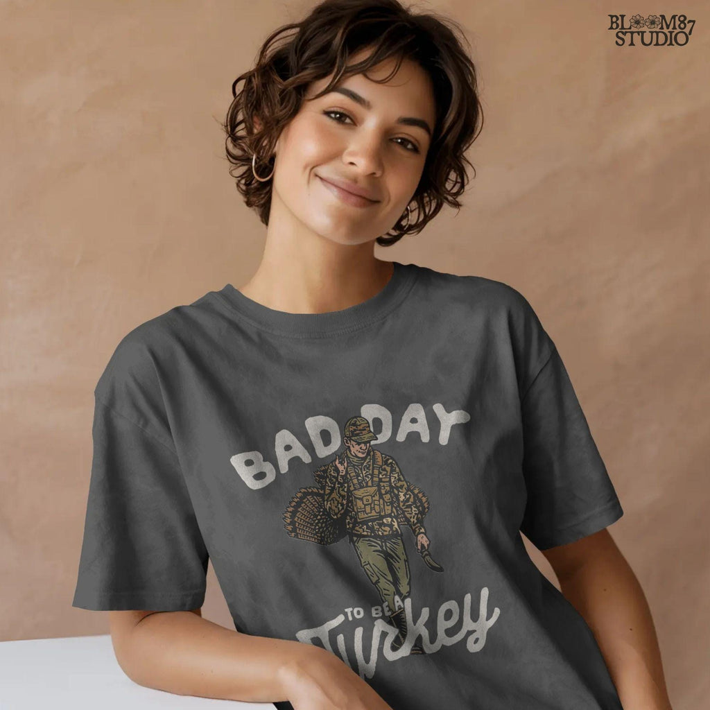 PNG artwork showing a proud hunter after a turkey hunt, with words “Bad Day To Be A Turkey.” Perfect for turkey hunting apparel, sublimation gifts, mugs, and funny Thanksgiving shirts for hunters.