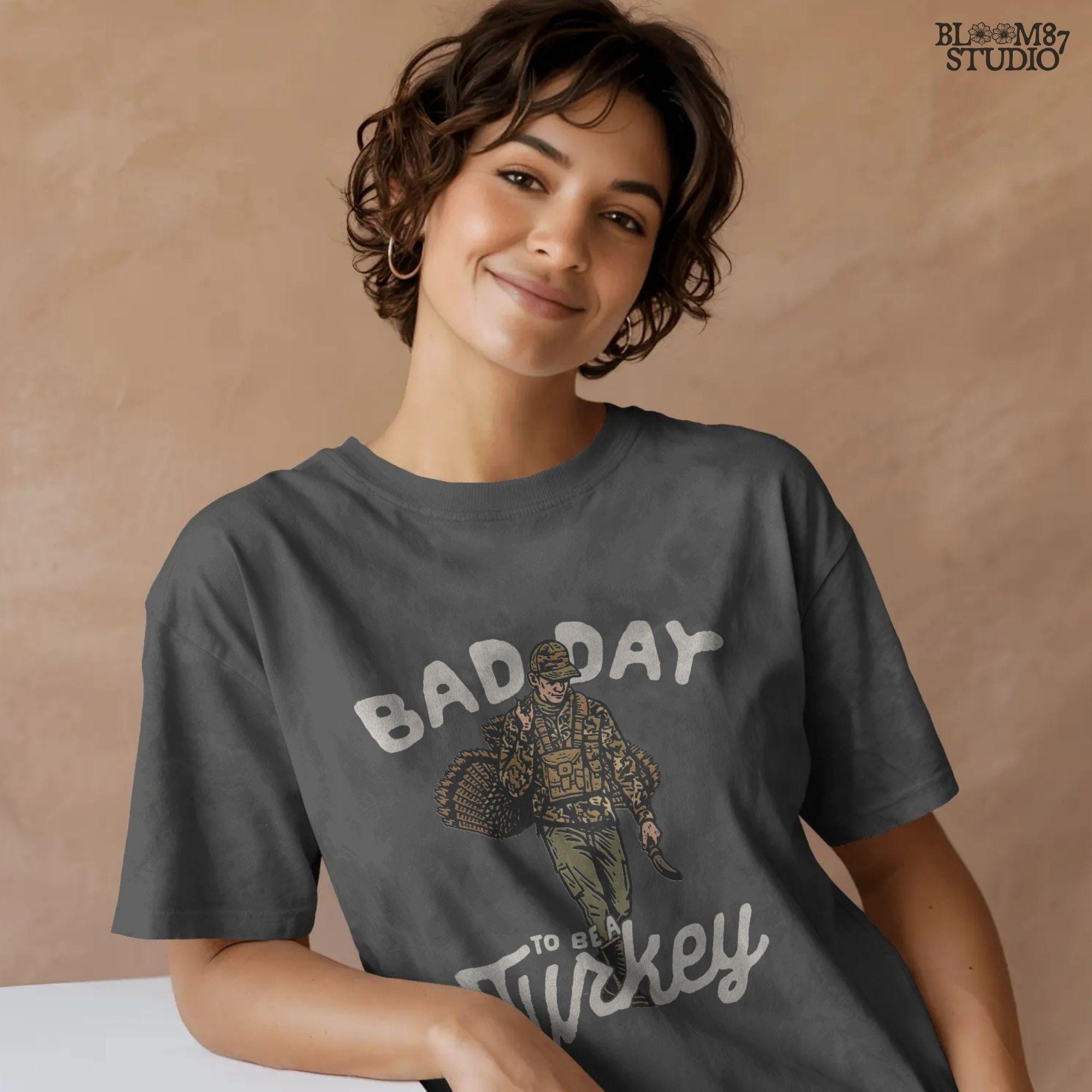 PNG artwork showing a proud hunter after a turkey hunt, with words “Bad Day To Be A Turkey.” Perfect for turkey hunting apparel, sublimation gifts, mugs, and funny Thanksgiving shirts for hunters.