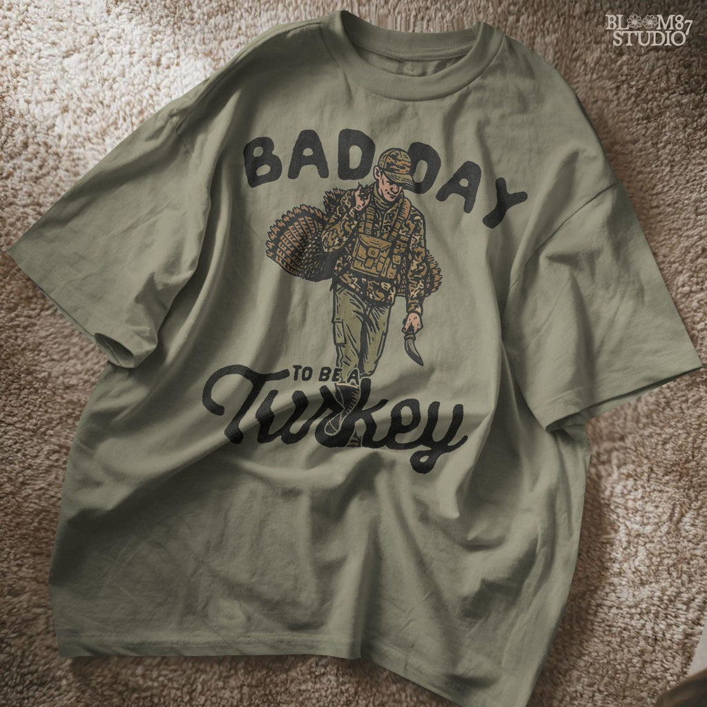 A unique design for hunters, this illustration shows a successful turkey hunt with the phrase “Bad Day To Be A Turkey.” Great for sublimation on clothing, mugs, tumblers, and printable gifts for Thanksgiving gatherings or hunting trips.