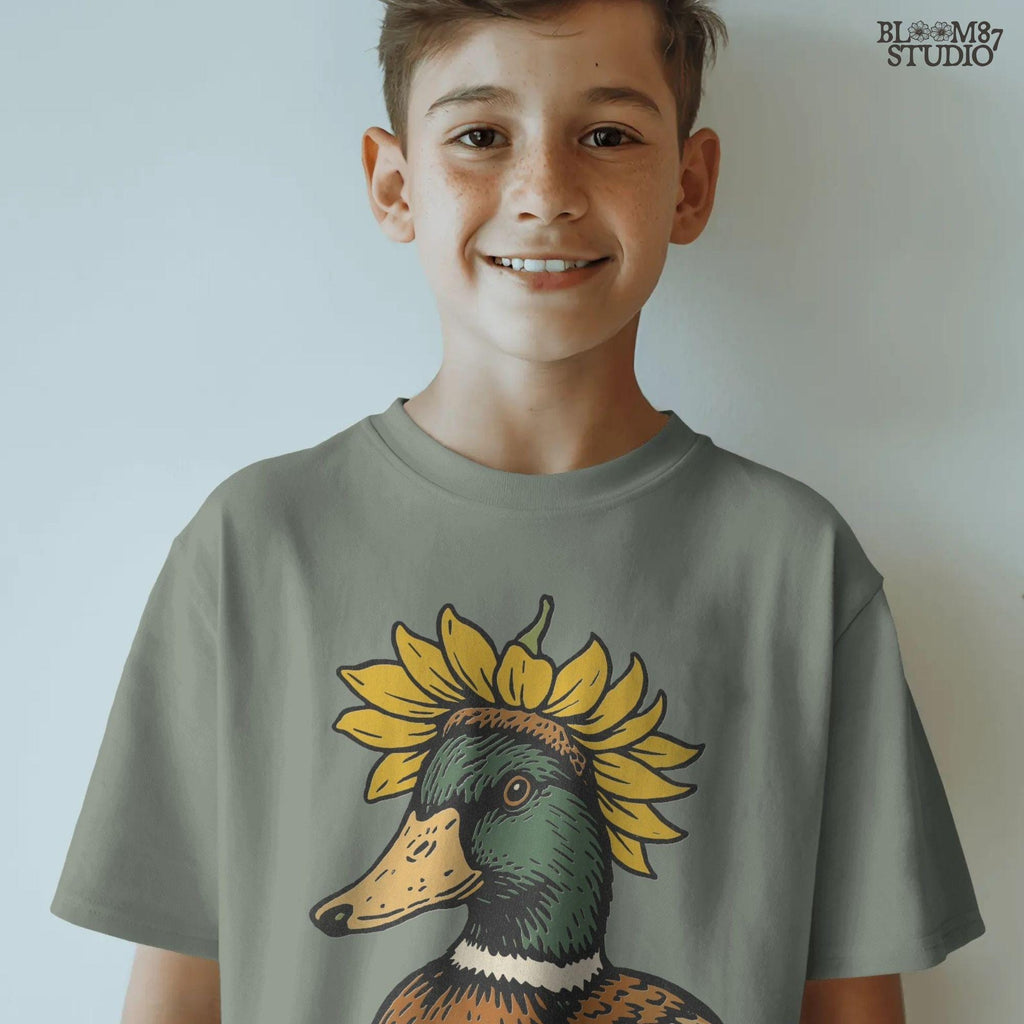 Solid Version:
Vintage illustration of a mallard duck head with a sunflower crown, sublimation PNG for farmhouse crafts and quirky animal designs.

Distressed Version:
Distressed-style sunflower duck head illustration, rustic sublimation PNG perfect for fall farmhouse art and whimsical wildlife projects.