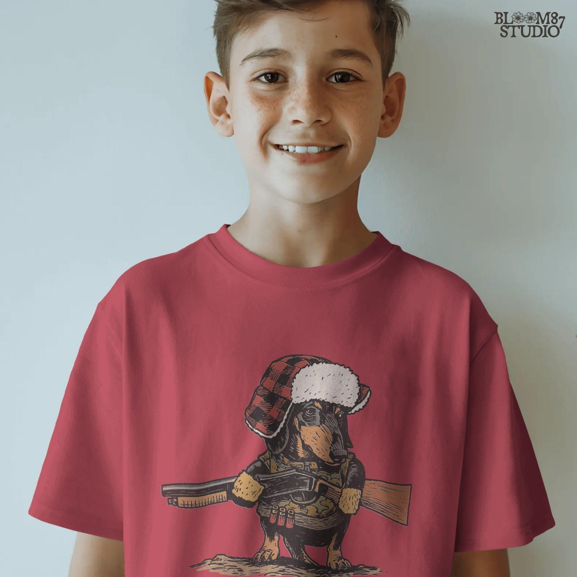 Solid Version:
Vintage illustration of a dachshund wearing a plaid trapper hat and holding a rifle, funny sublimation PNG for hunting-themed crafts and rustic lodge art.

Distressed Version:
Distressed artwork of a hunting dachshund in plaid hat with rifle, quirky sublimation PNG for rustic lodge decor, humorous shirts, and pet designs.