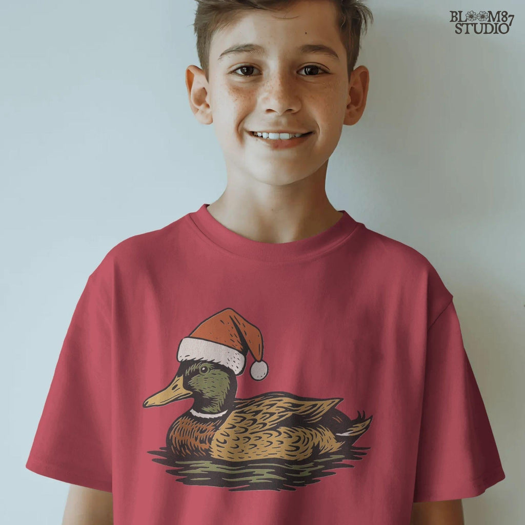 Solid Version:
Vintage illustration of a mallard duck wearing a Santa hat floating on water, sublimation PNG for rustic Christmas crafts and farmhouse holiday decor.

Distressed Version:
Distressed artwork of a festive duck with Santa hat on water, rustic sublimation PNG perfect for farmhouse Christmas shirts, mugs, and seasonal crafts.