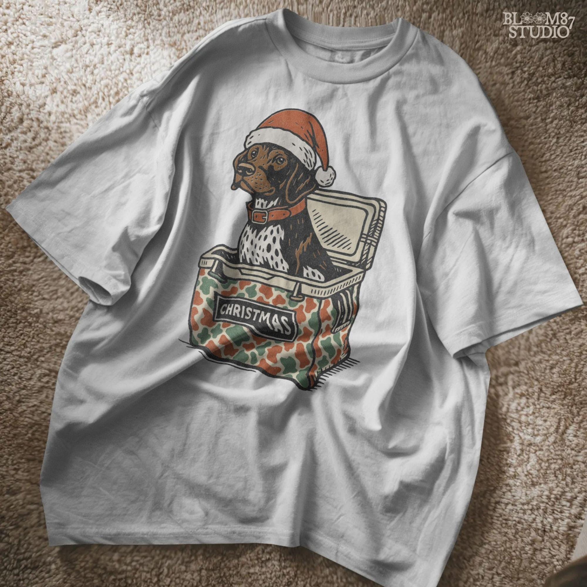 Solid Version:
Vintage illustration of a dog in a Santa hat sitting inside a camo-patterned Christmas cooler, sublimation PNG for rustic holiday crafts and pet decor.

Distressed Version:
Distressed artwork of a Christmas dog in camo cooler with Santa hat, funny sublimation PNG perfect for farmhouse festive shirts, mugs, and seasonal gifts.