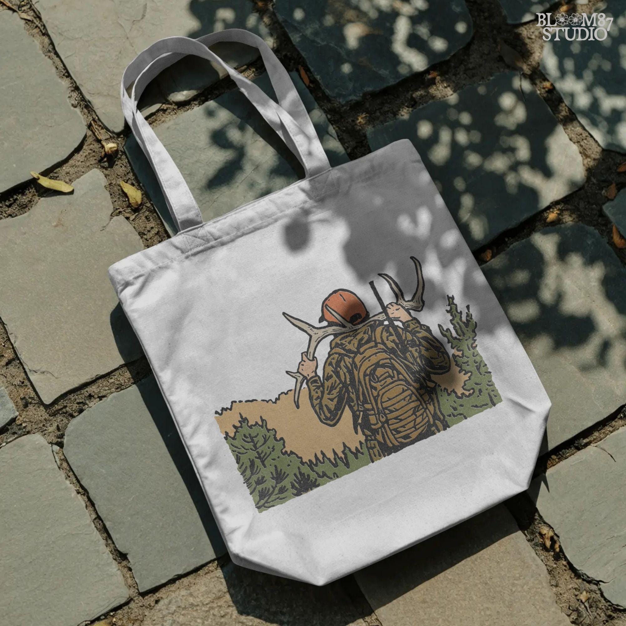 Solid version:
“Hunter carrying deer antlers on shoulders with backpack and rifle in forest – rustic hunting sublimation PNG for outdoor crafts”

Distressed version:
“Vintage distressed hunting sublimation PNG of hunter in camo with backpack and rifle carrying antlers in forest”