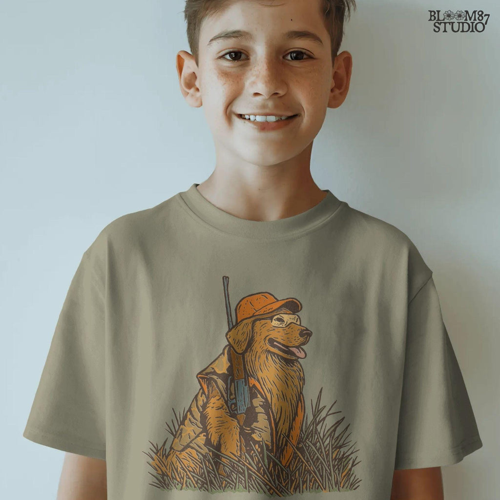 Solid version:
“Golden retriever hunting dog wearing orange camo with rifle sitting in tall grass – rustic hunting sublimation PNG for crafts and shirts”

Distressed version:
“Vintage distressed hunting sublimation PNG of golden retriever dog in orange camo with rifle sitting in tall grass – rustic outdoor shirt design”