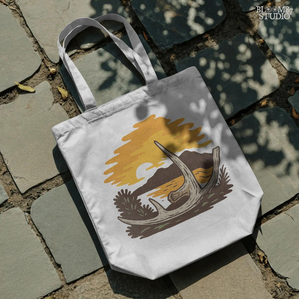 Solid version:
“Deer shed antlers on ground with fall sunset, mountains, and lake – rustic autumn antler sublimation PNG for shirts and crafts”

Distressed version:
“Vintage distressed sublimation PNG of deer shed antlers at autumn sunset by mountains and lake – rustic hunting season design”