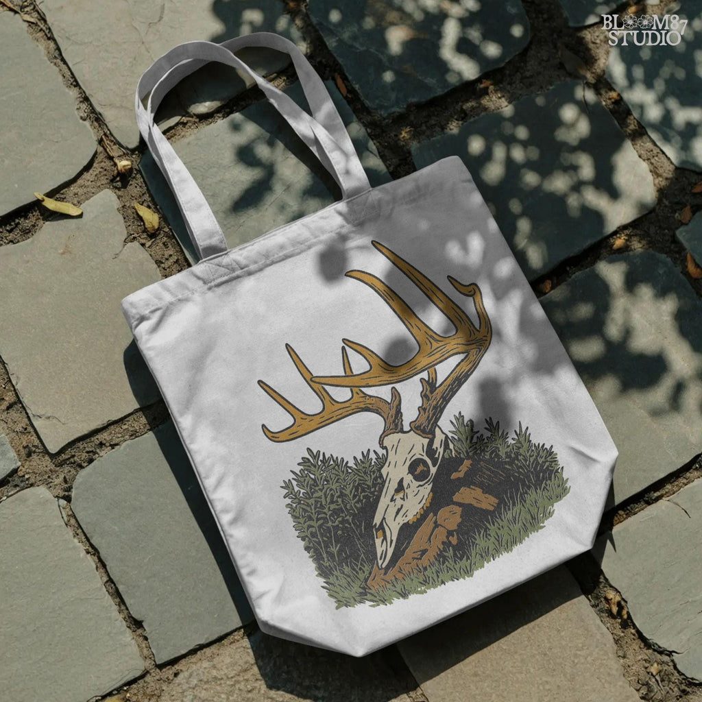 Solid version:
“Deer skull with large antlers resting in grass and rocks – rustic hunting sublimation PNG for crafts and lodge décor”

Distressed version:
“Vintage distressed sublimation PNG of deer skull with antlers in grass – rustic hunting and outdoor lodge shirt design”