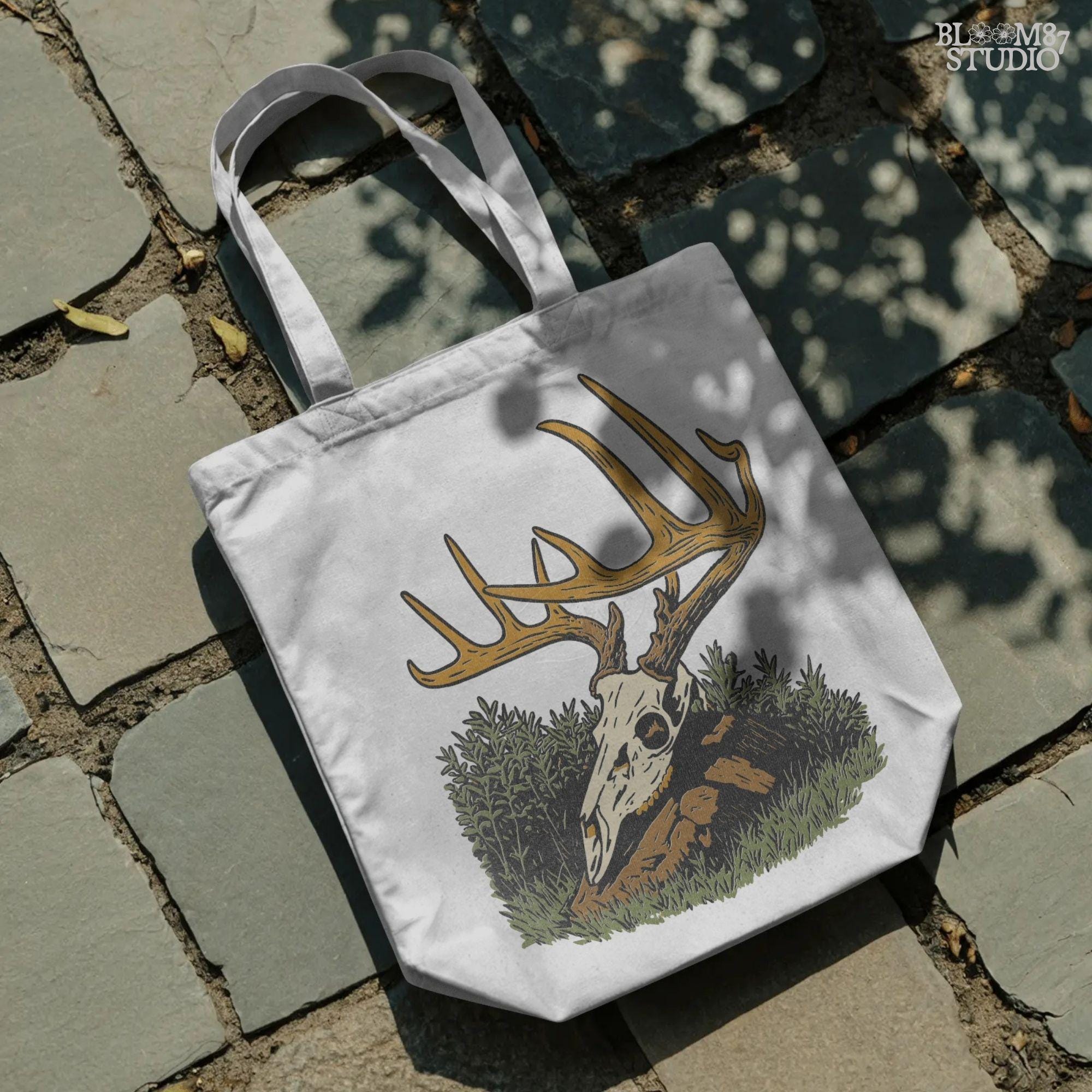 Solid version:
“Deer skull with large antlers resting in grass and rocks – rustic hunting sublimation PNG for crafts and lodge décor”

Distressed version:
“Vintage distressed sublimation PNG of deer skull with antlers in grass – rustic hunting and outdoor lodge shirt design”