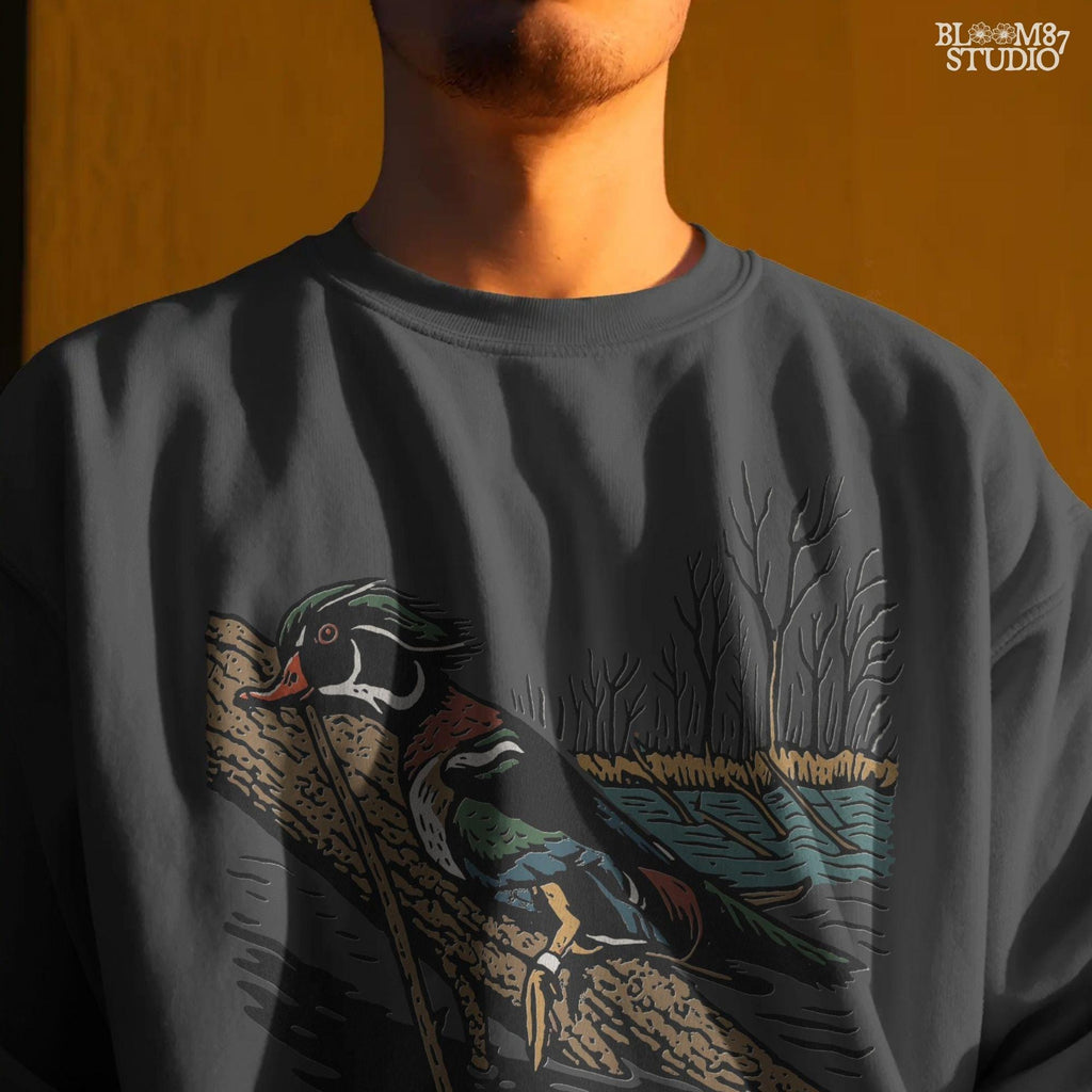 Solid version:
“Colorful wood duck perched on tree branch by lake with trees – waterfowl sublimation PNG for hunting and outdoor crafts”

Distressed version:
“Vintage distressed sublimation PNG of wood duck on branch by lake and trees – rustic hunting and lodge décor design”