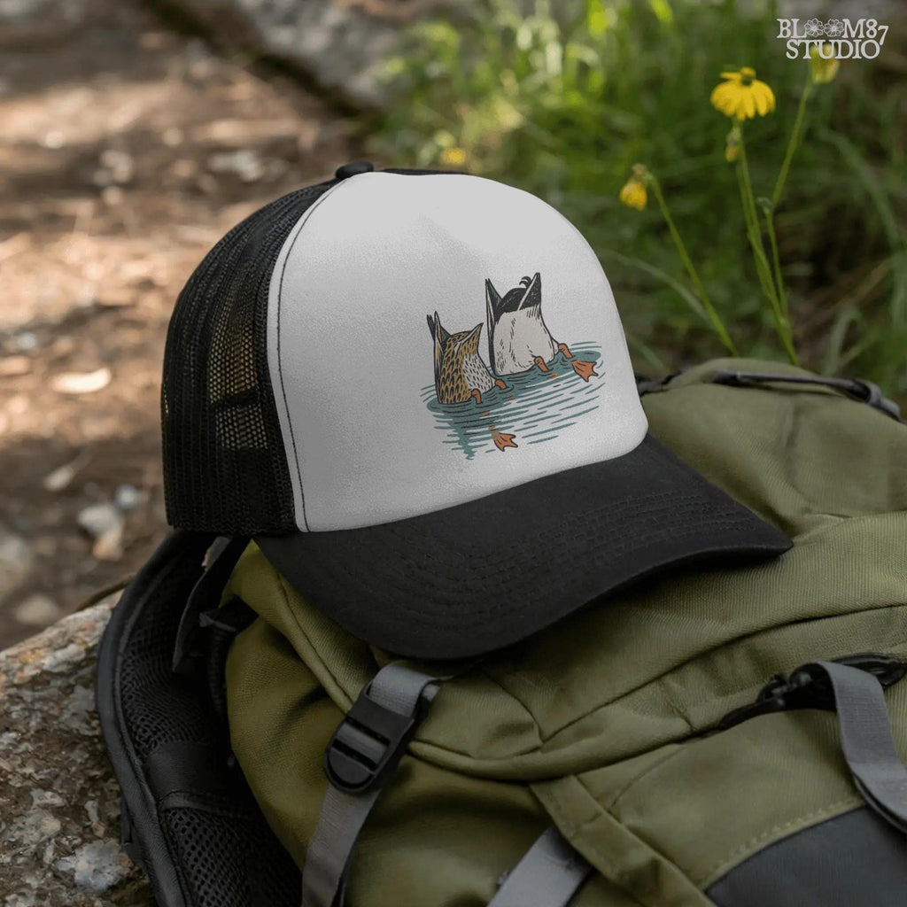 Solid version:
“Two ducks dabbling with tails up and feet in water – funny duck sublimation PNG for hunting shirts and rustic crafts”

Distressed version:
“Vintage distressed sublimation PNG of two ducks with tails up in pond – funny waterfowl hunting and rustic outdoor design”