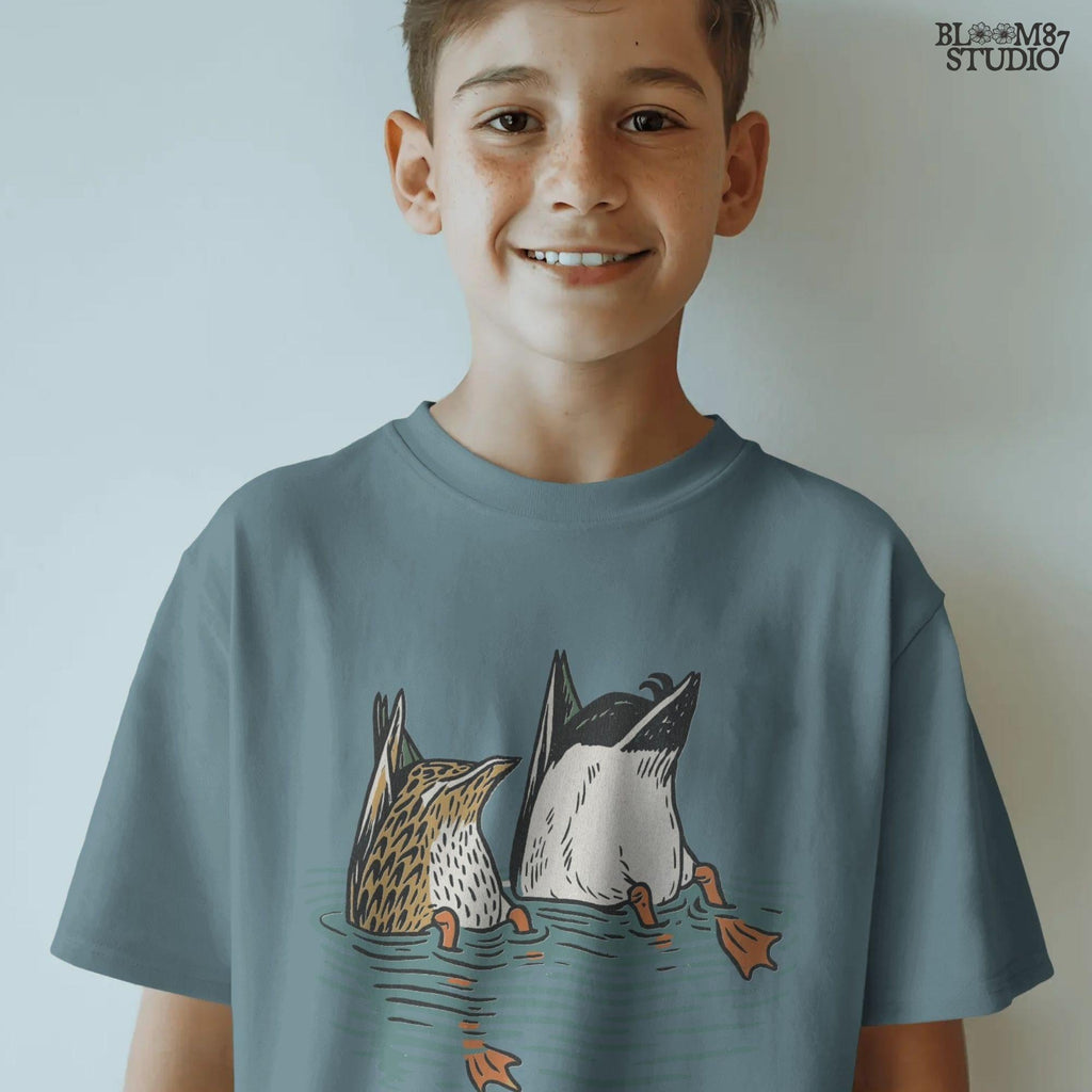 Solid version:
“Two ducks dabbling with tails up and feet in water – funny duck sublimation PNG for hunting shirts and rustic crafts”

Distressed version:
“Vintage distressed sublimation PNG of two ducks with tails up in pond – funny waterfowl hunting and rustic outdoor design”