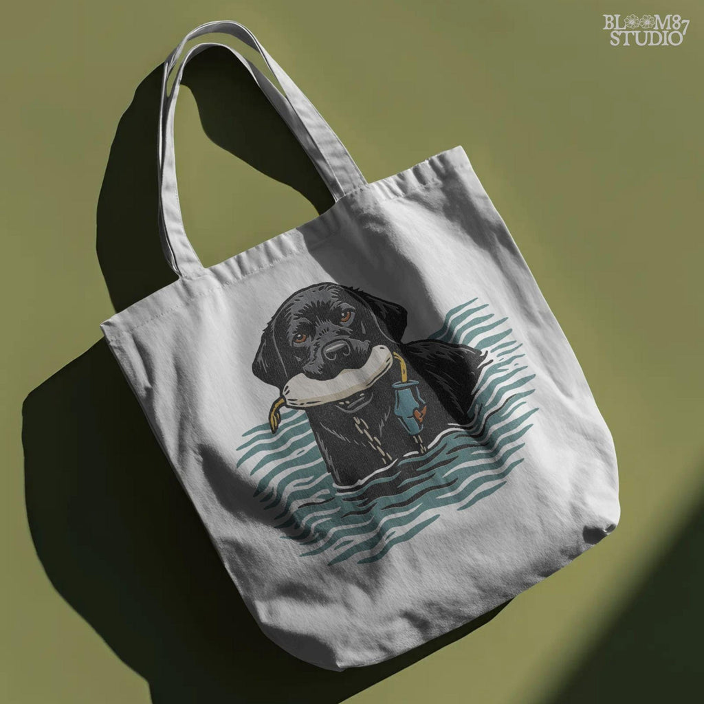 Solid version:
“Black lab retriever swimming in water holding training bumper – hunting dog sublimation PNG for shirts and outdoor crafts”

Distressed version:
“Vintage distressed sublimation PNG of black lab hunting retriever with bumper in water – rustic outdoor and hunting shirt design”