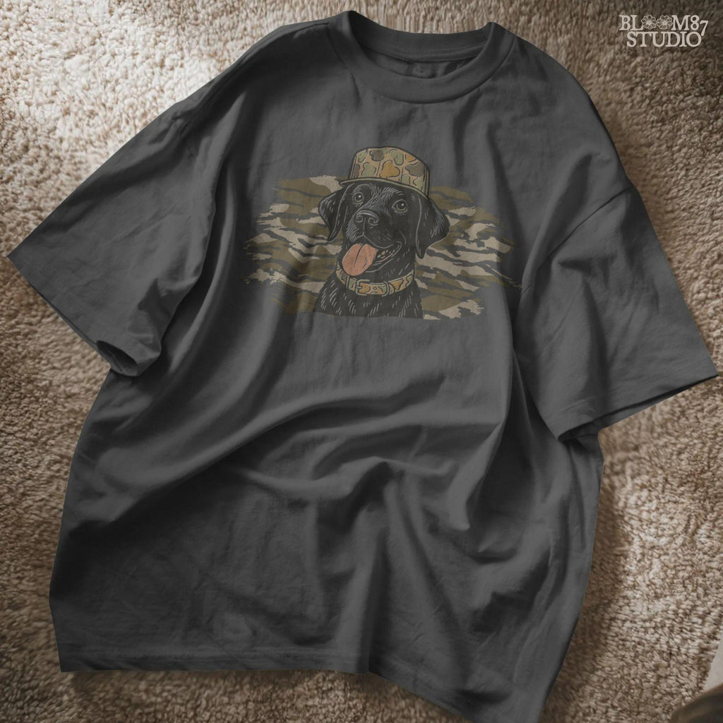 Solid version: Illustration of a black Labrador retriever wearing a camo hat and collar with camouflage background, hunting sublimation PNG.
Distressed version: Vintage distressed black lab with camo hat and collar against camo background, rustic hunting dog sublimation PNG.
