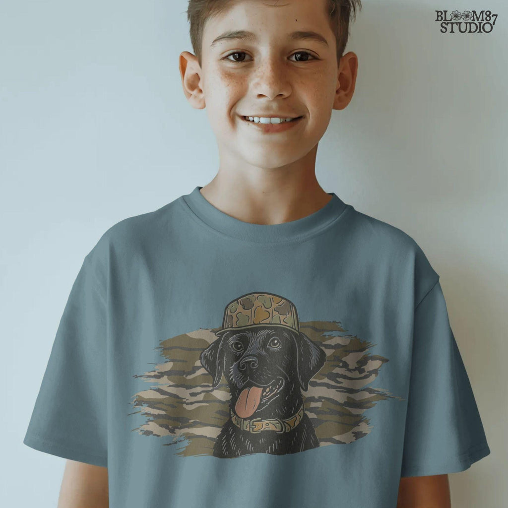 Solid version: Illustration of a black Labrador retriever wearing a camo hat and collar with camouflage background, hunting sublimation PNG.
Distressed version: Vintage distressed black lab with camo hat and collar against camo background, rustic hunting dog sublimation PNG.