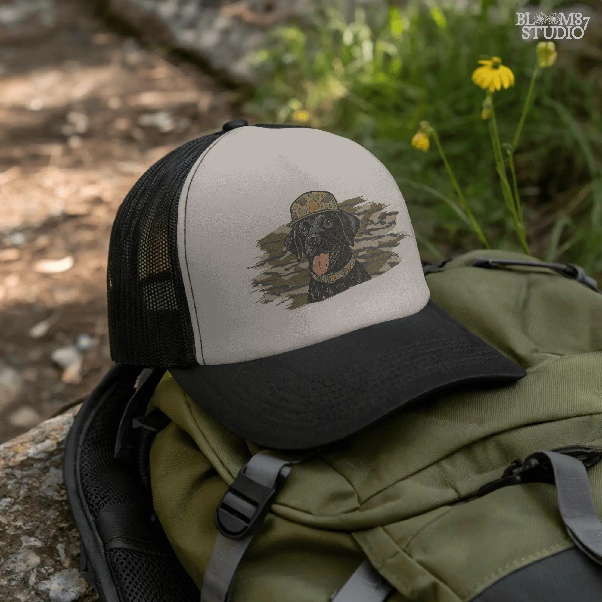 Solid version: Illustration of a black Labrador retriever wearing a camo hat and collar with camouflage background, hunting sublimation PNG.
Distressed version: Vintage distressed black lab with camo hat and collar against camo background, rustic hunting dog sublimation PNG.