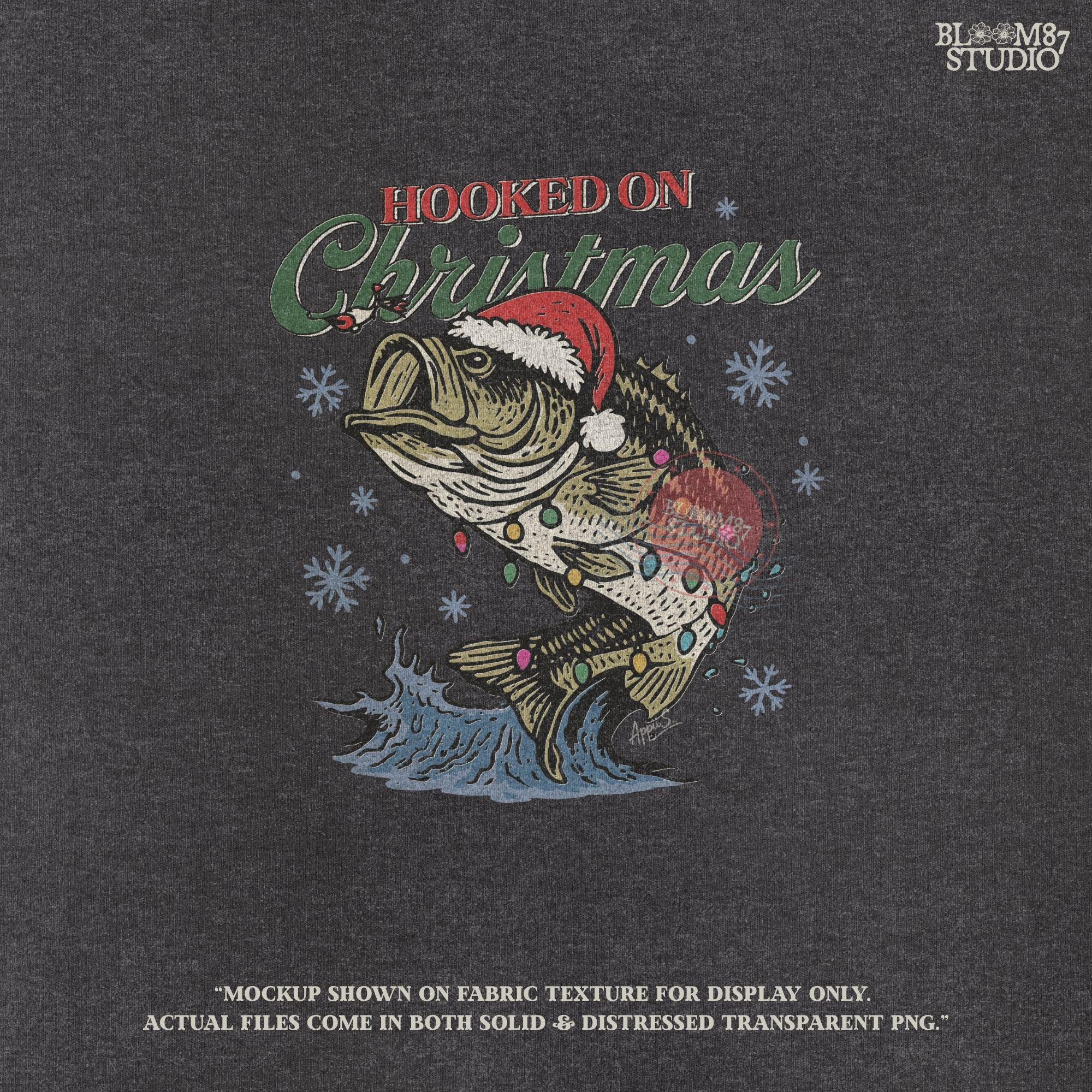 Hooked on Christmas fishing design with bass fish, Santa hat, and snowflakes, ideal for holiday apparel and fisherman gifts.